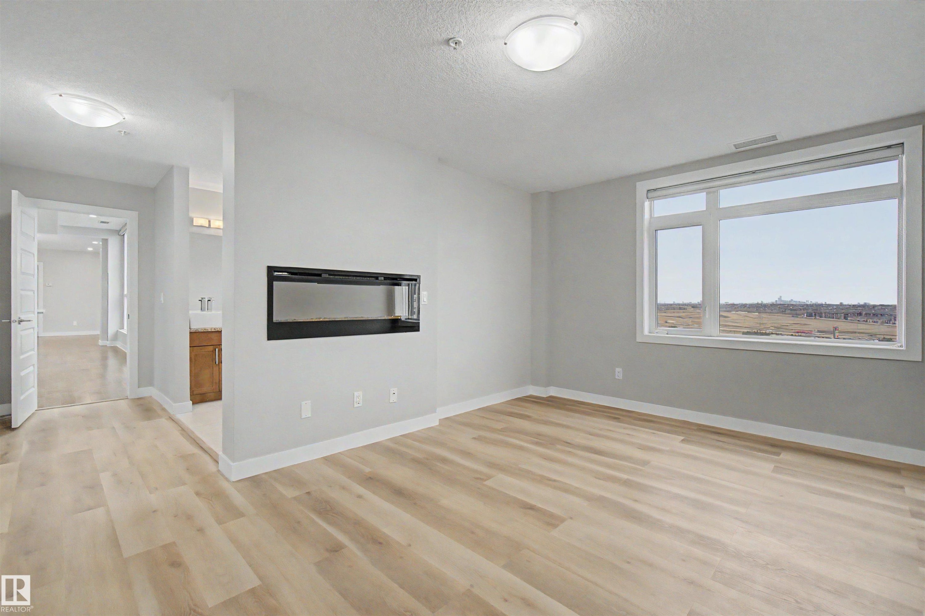 #1225 5151 Windermere Bv Sw, Edmonton, AB - Indoor With Fireplace