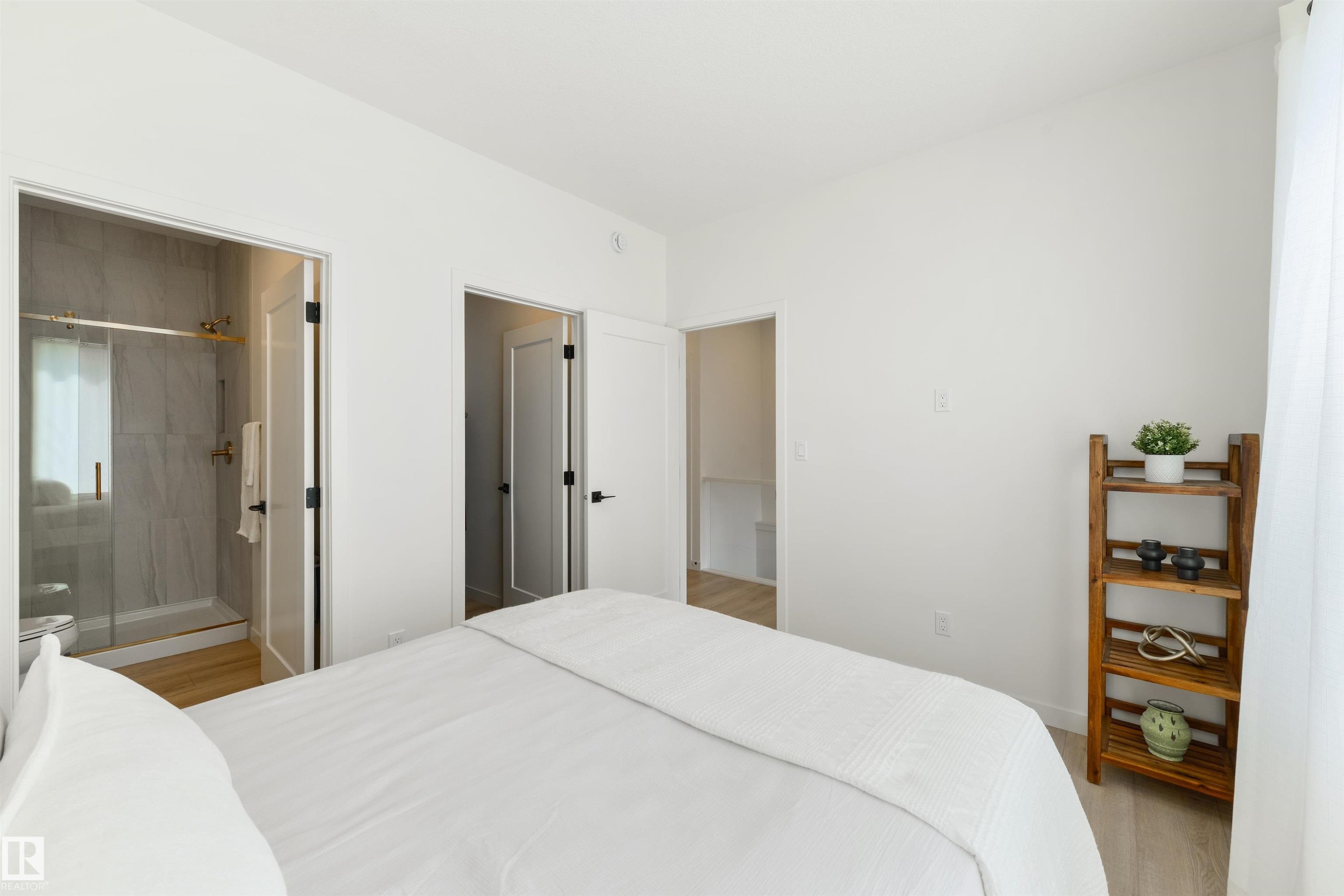 Bedroom with light wood-finish flooring and white walls - 323 Rankin Drive, St. Albert, AB - Indoor Photo Showing Bedroom