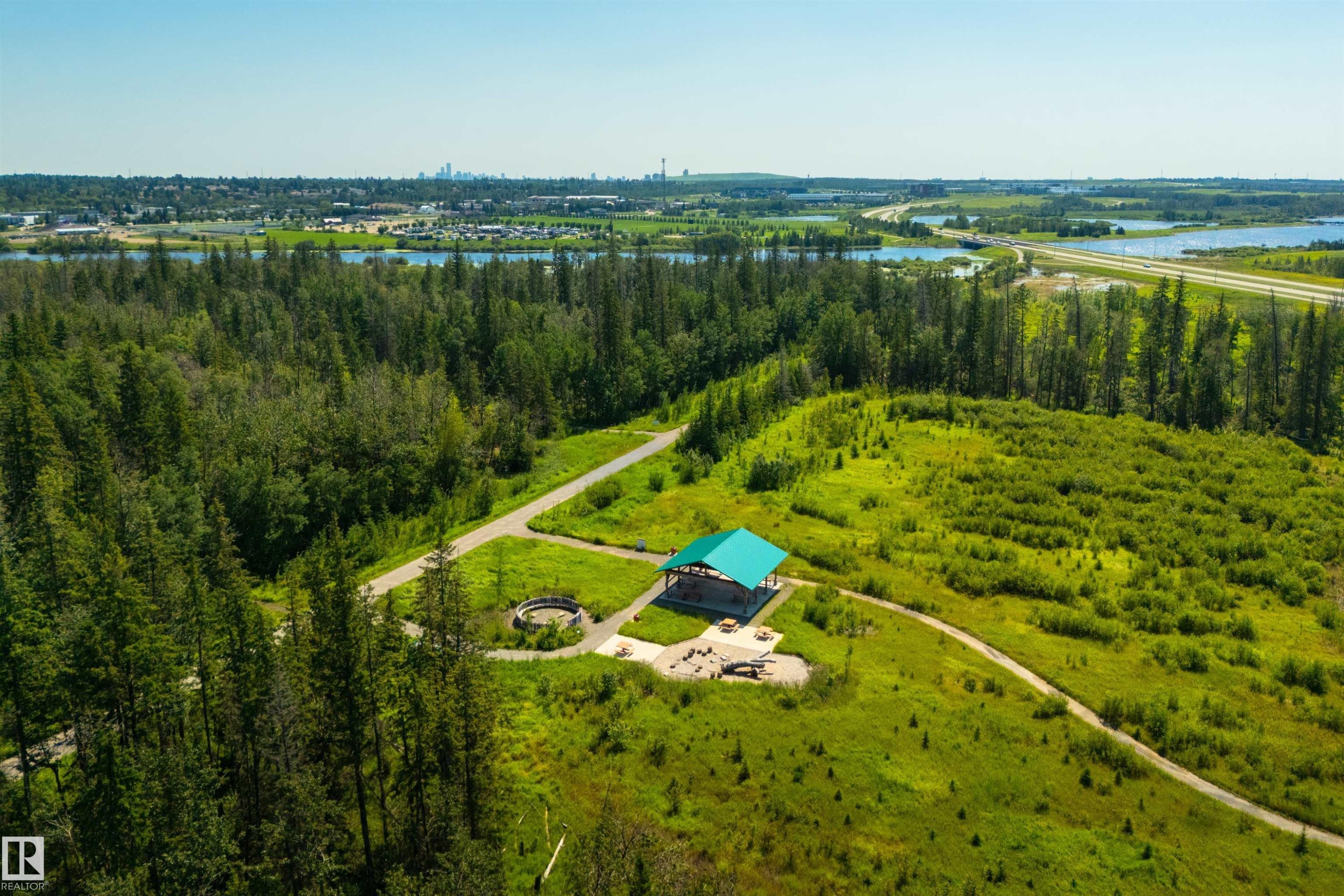 Expansive natural landscape featuring lush green foliage and mature evergreen trees - 323 Rankin Drive, St. Albert, AB - Outdoor With View