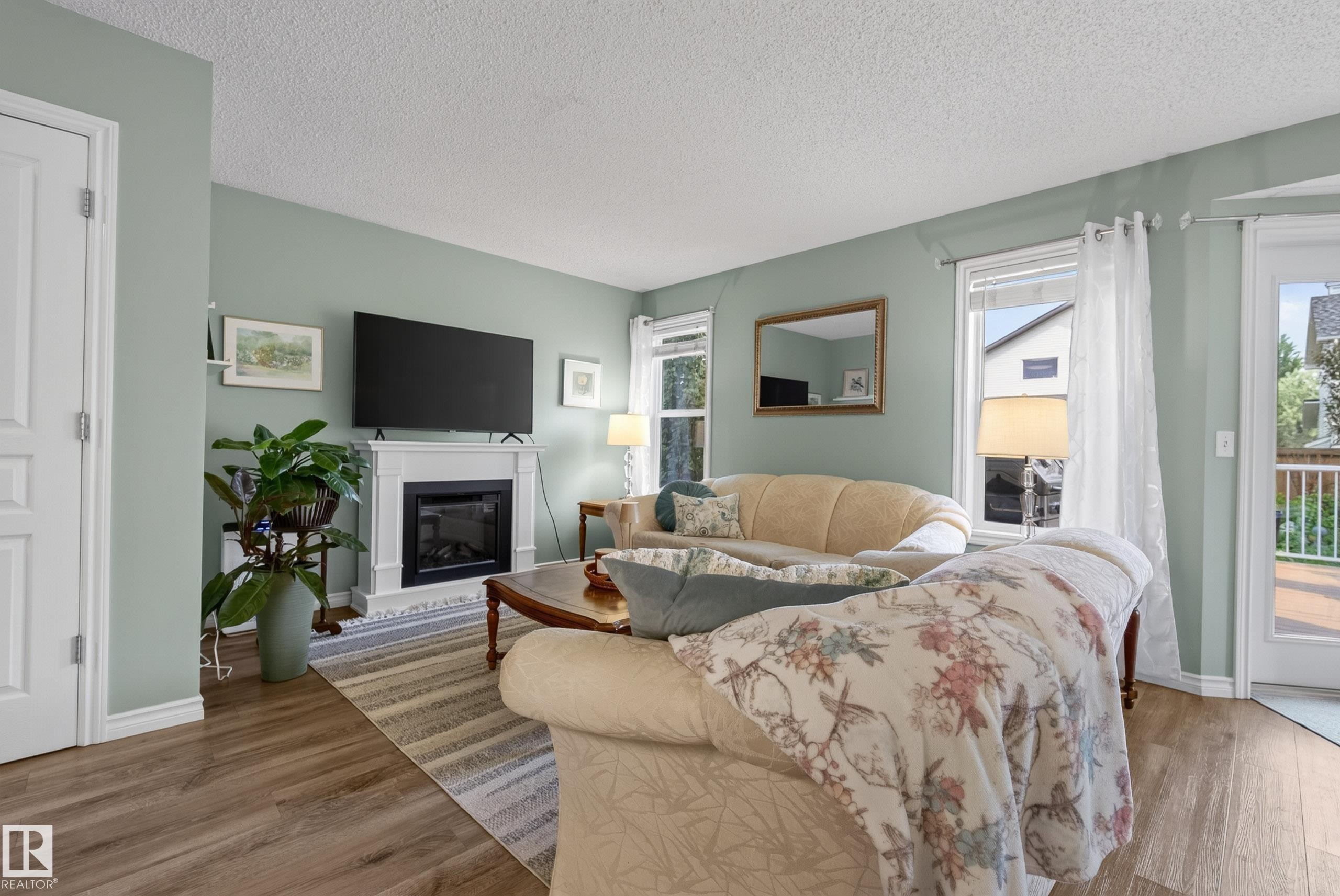 76 Leyland Way, Spruce Grove, AB - Indoor Photo Showing Living Room With Fireplace