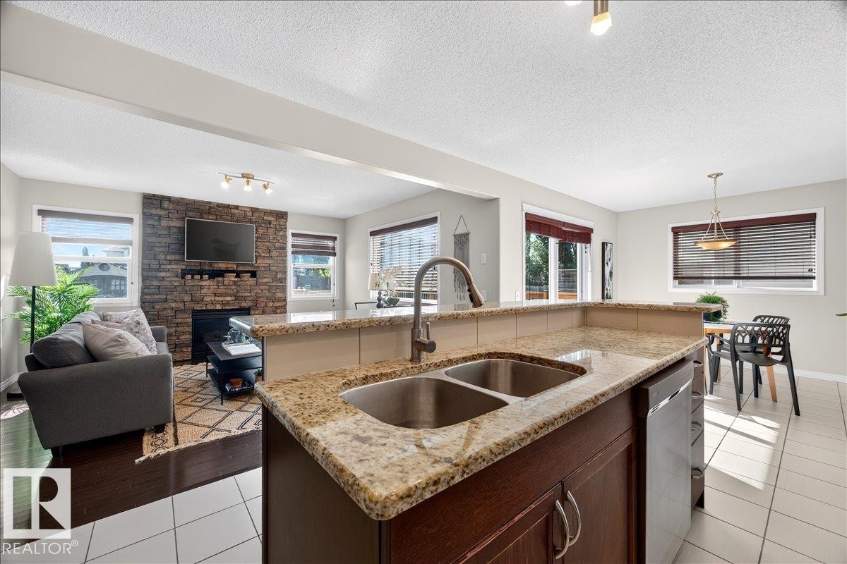 18069 89 Street Nw, Edmonton, AB - Indoor Photo Showing Kitchen With Fireplace With Double Sink