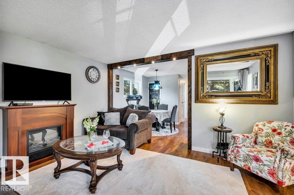 216 Greenwood Drive, Spruce Grove, AB - Indoor Photo Showing Living Room With Fireplace