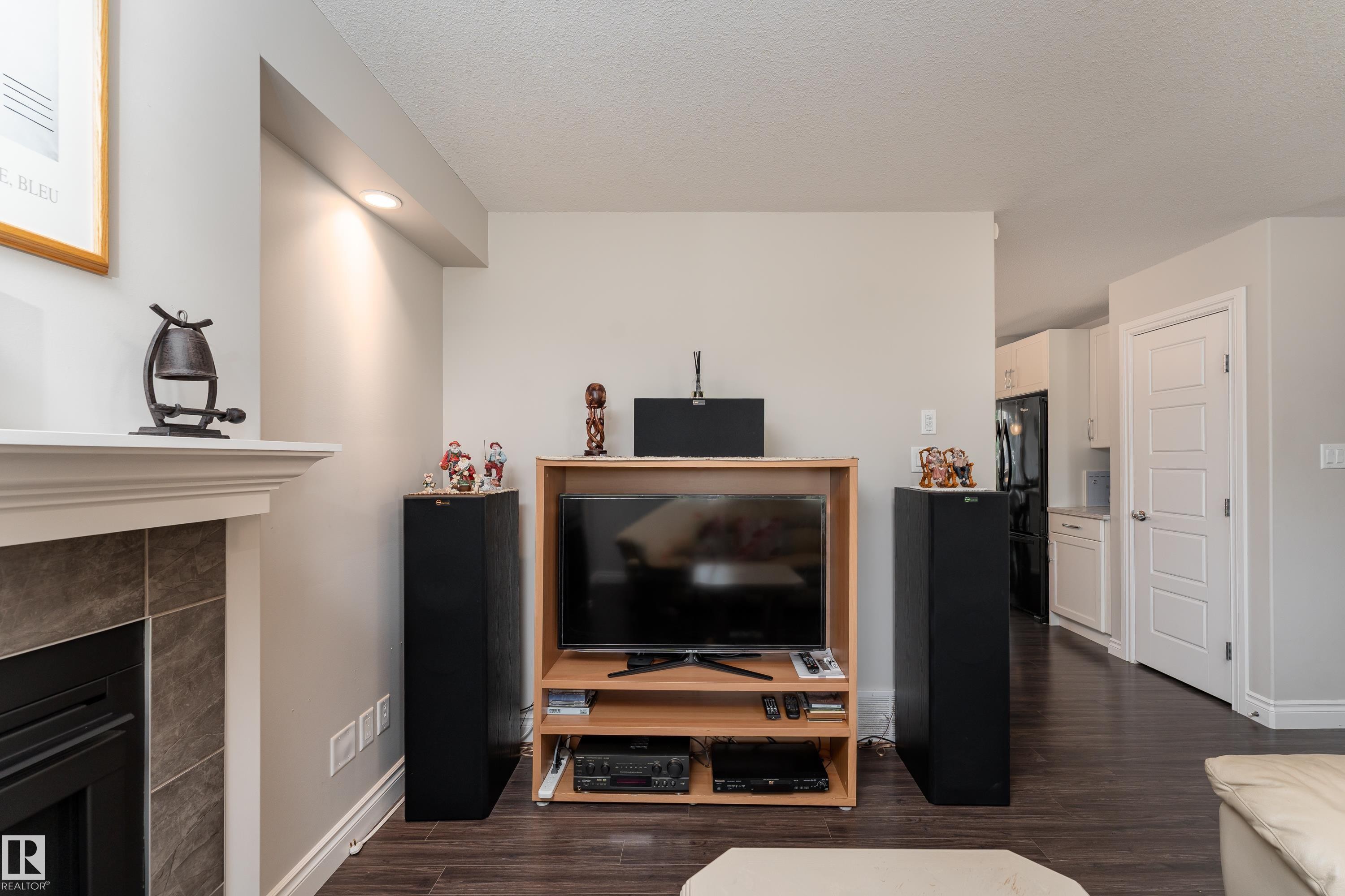 2338 Glenridding Boulevard Sw, Edmonton, AB - Indoor Photo Showing Living Room With Fireplace