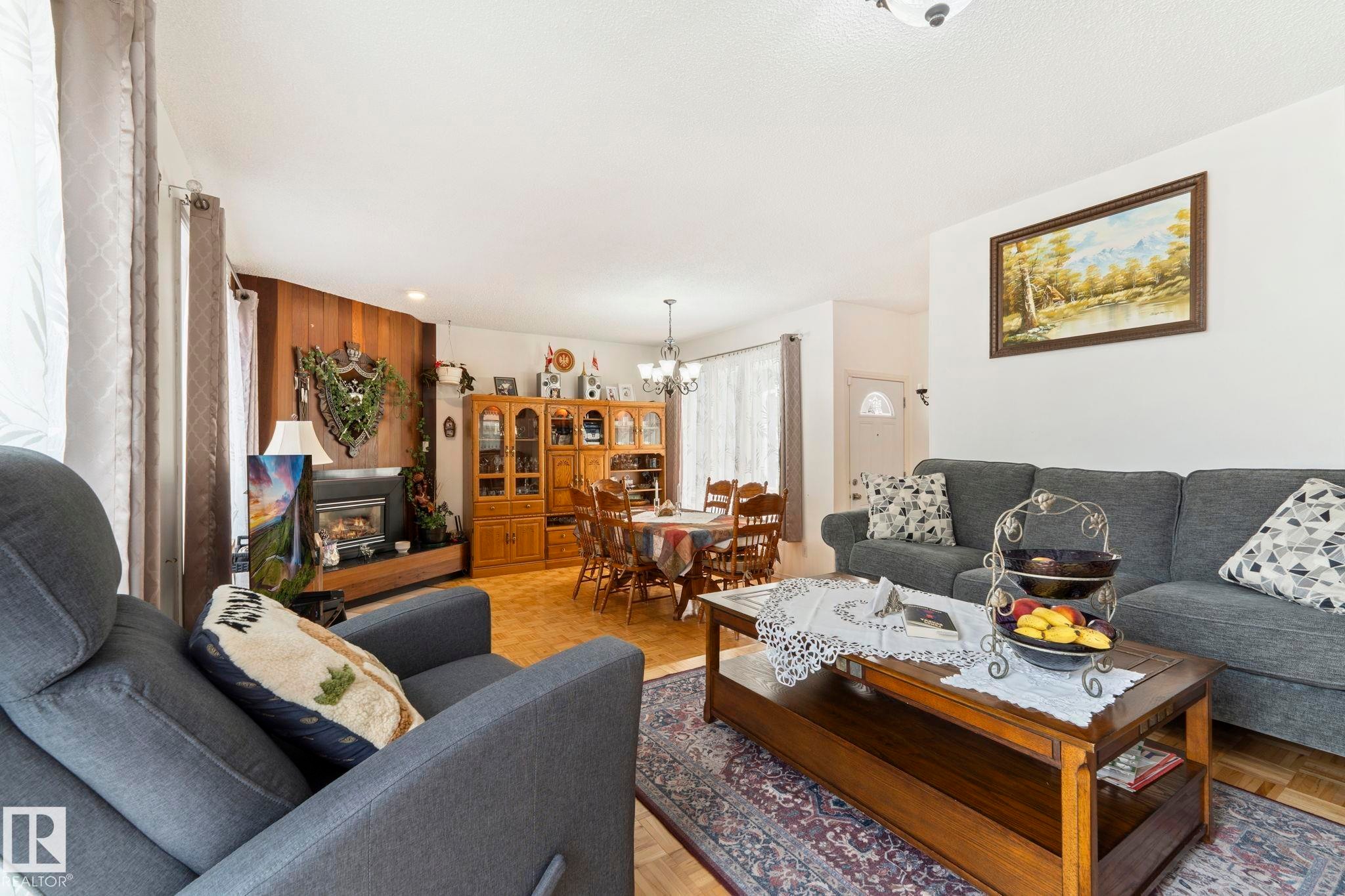 8704 43 Avenue Nw, Edmonton, AB - Indoor Photo Showing Living Room With Fireplace