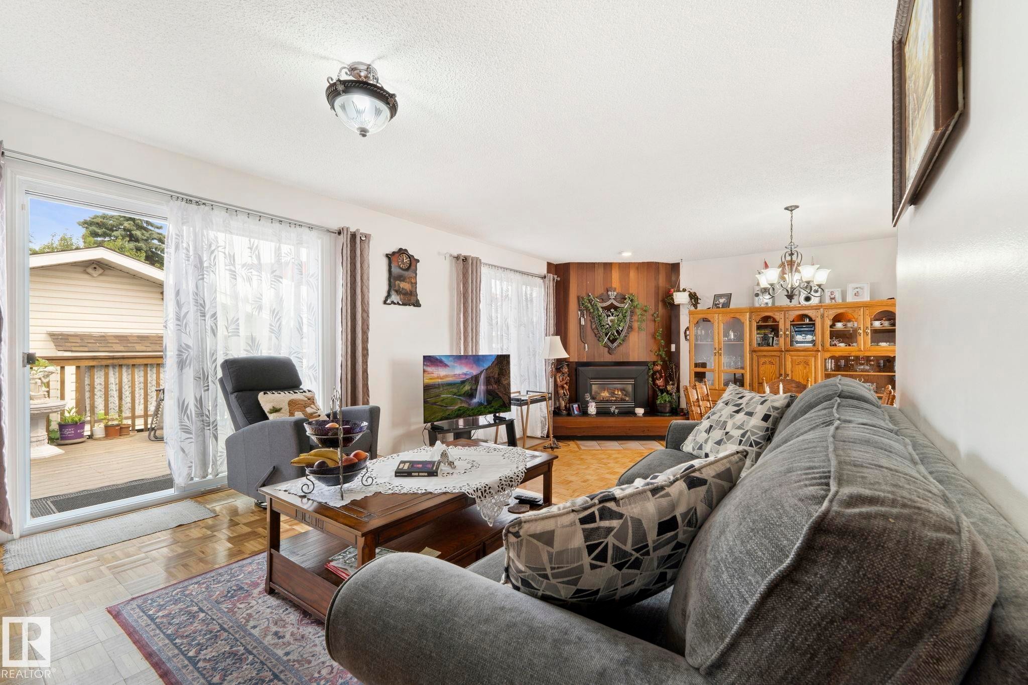 8704 43 Avenue Nw, Edmonton, AB - Indoor Photo Showing Living Room With Fireplace