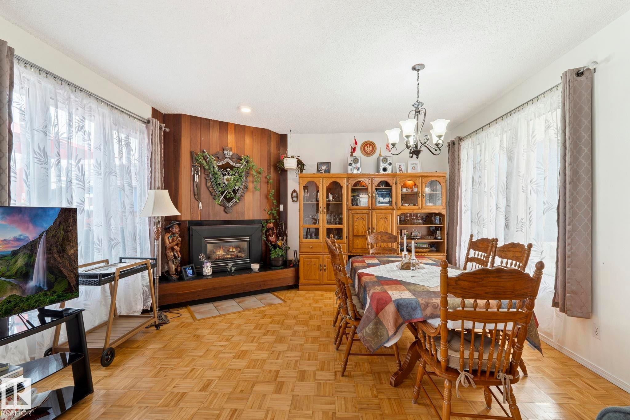 8704 43 Avenue Nw, Edmonton, AB - Indoor Photo Showing Dining Room With Fireplace
