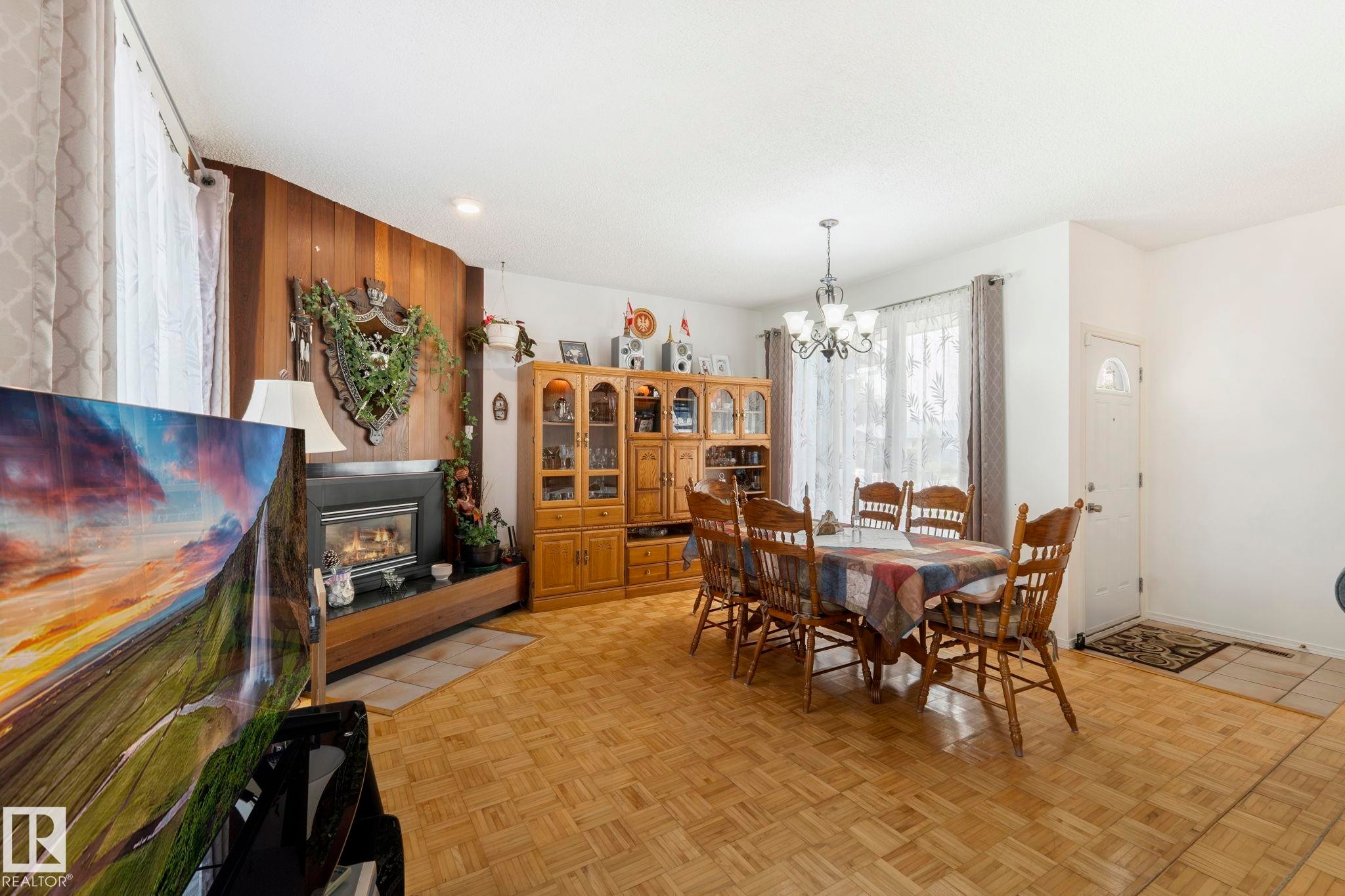 8704 43 Avenue Nw, Edmonton, AB - Indoor Photo Showing Dining Room With Fireplace