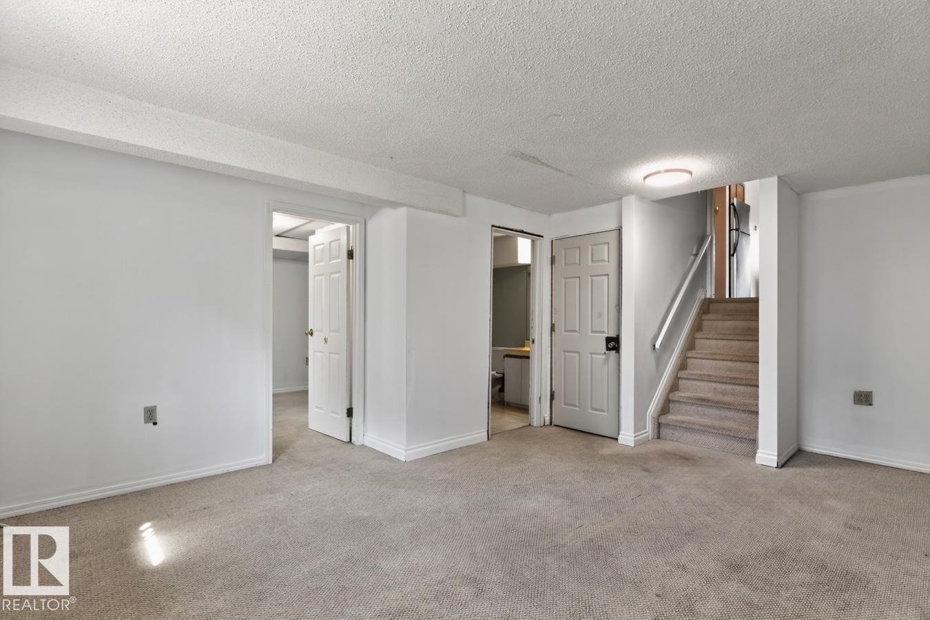 Carpeted room with white walls, baseboards, and trim - 4003 41 Avenue Nw, Edmonton, AB - Indoor Photo Showing Other Room