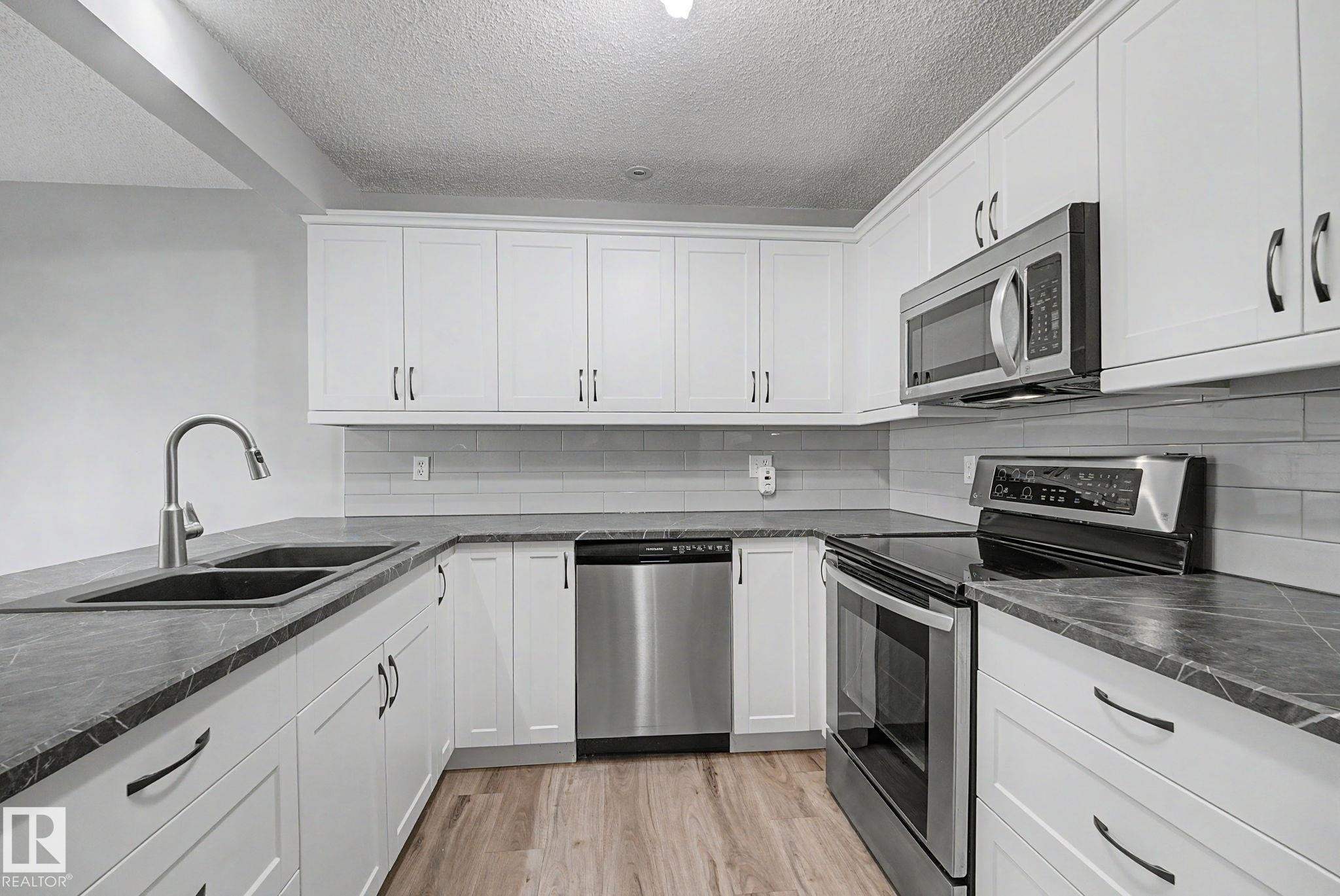 #7 10 Devon Cl, St. Albert, AB - Indoor Photo Showing Kitchen With Stainless Steel Kitchen With Double Sink