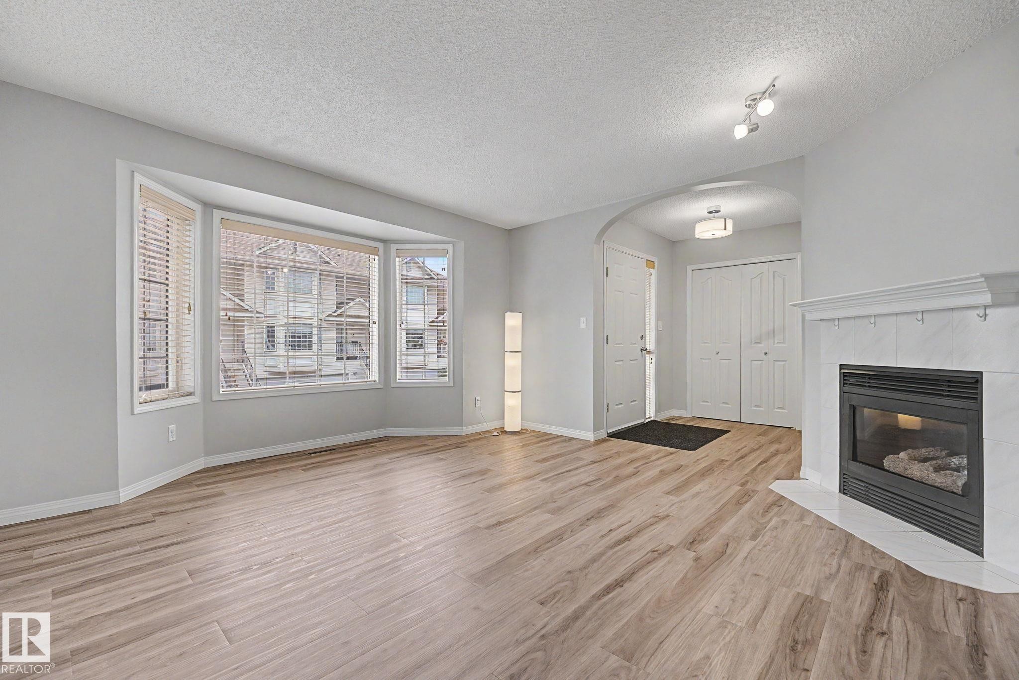 #7 10 Devon Cl, St. Albert, AB - Indoor Photo Showing Living Room With Fireplace