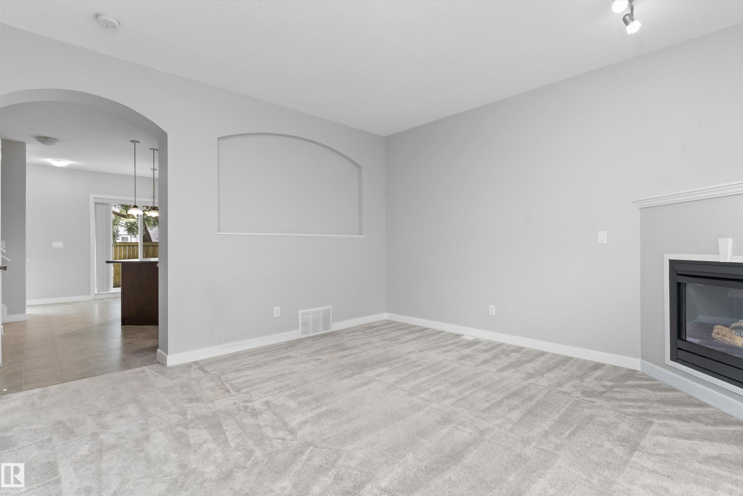 #7 13825 155 Av Nw, Edmonton, AB - Indoor With Fireplace