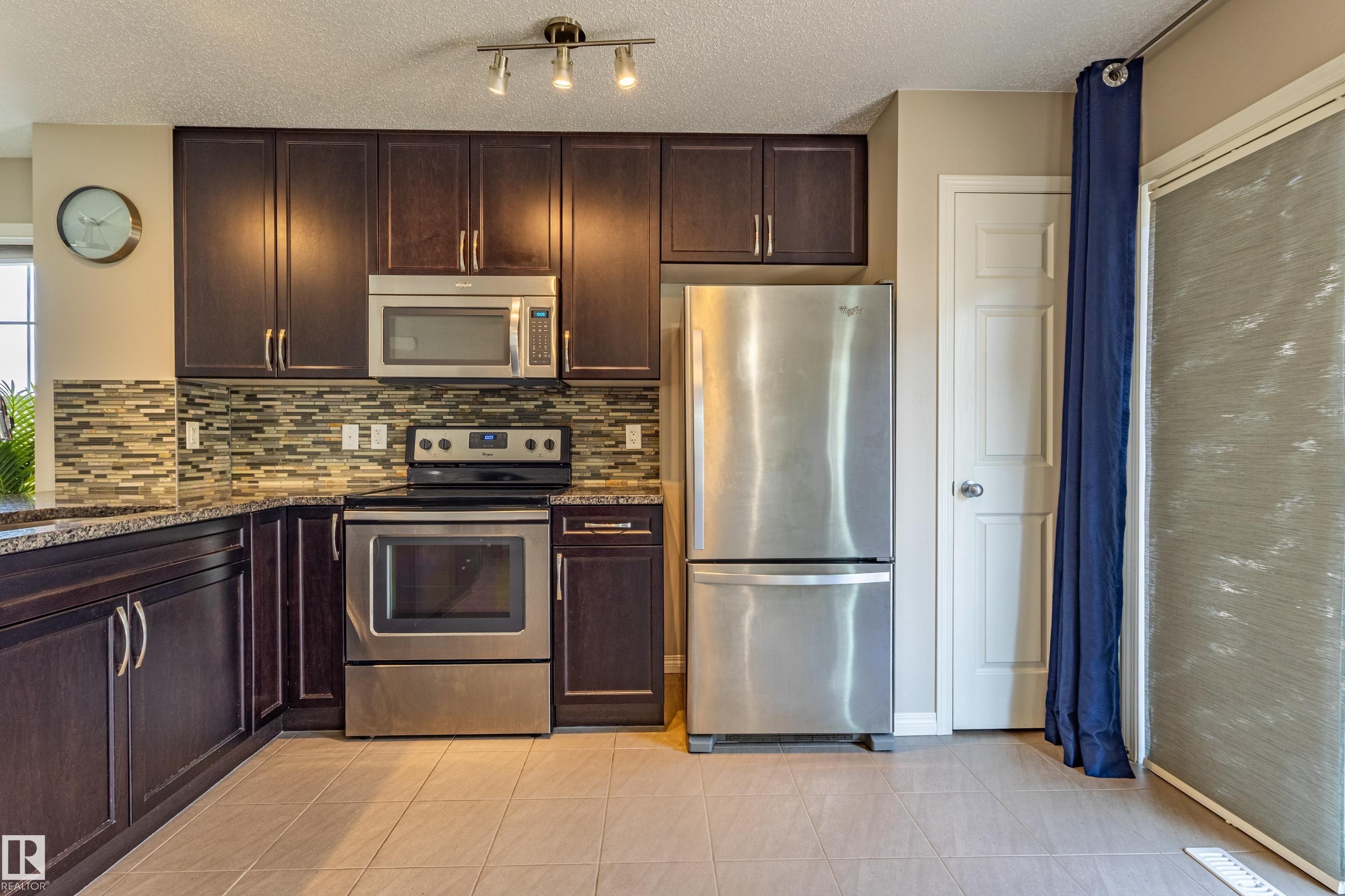 #54 4029 Orchards Dr Sw, Edmonton, AB - Indoor Photo Showing Kitchen With Stainless Steel Kitchen