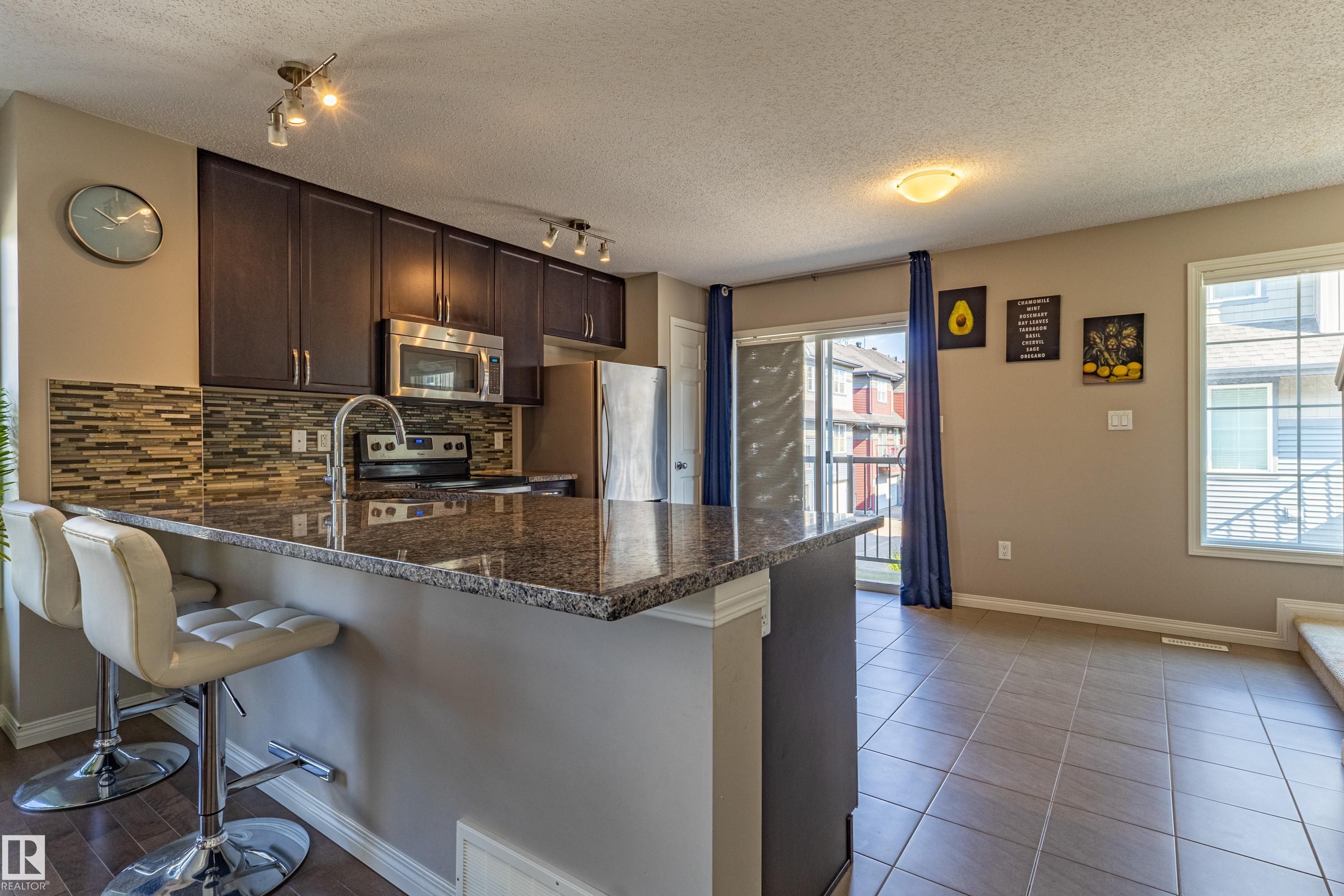 #54 4029 Orchards Dr Sw, Edmonton, AB - Indoor Photo Showing Kitchen With Double Sink