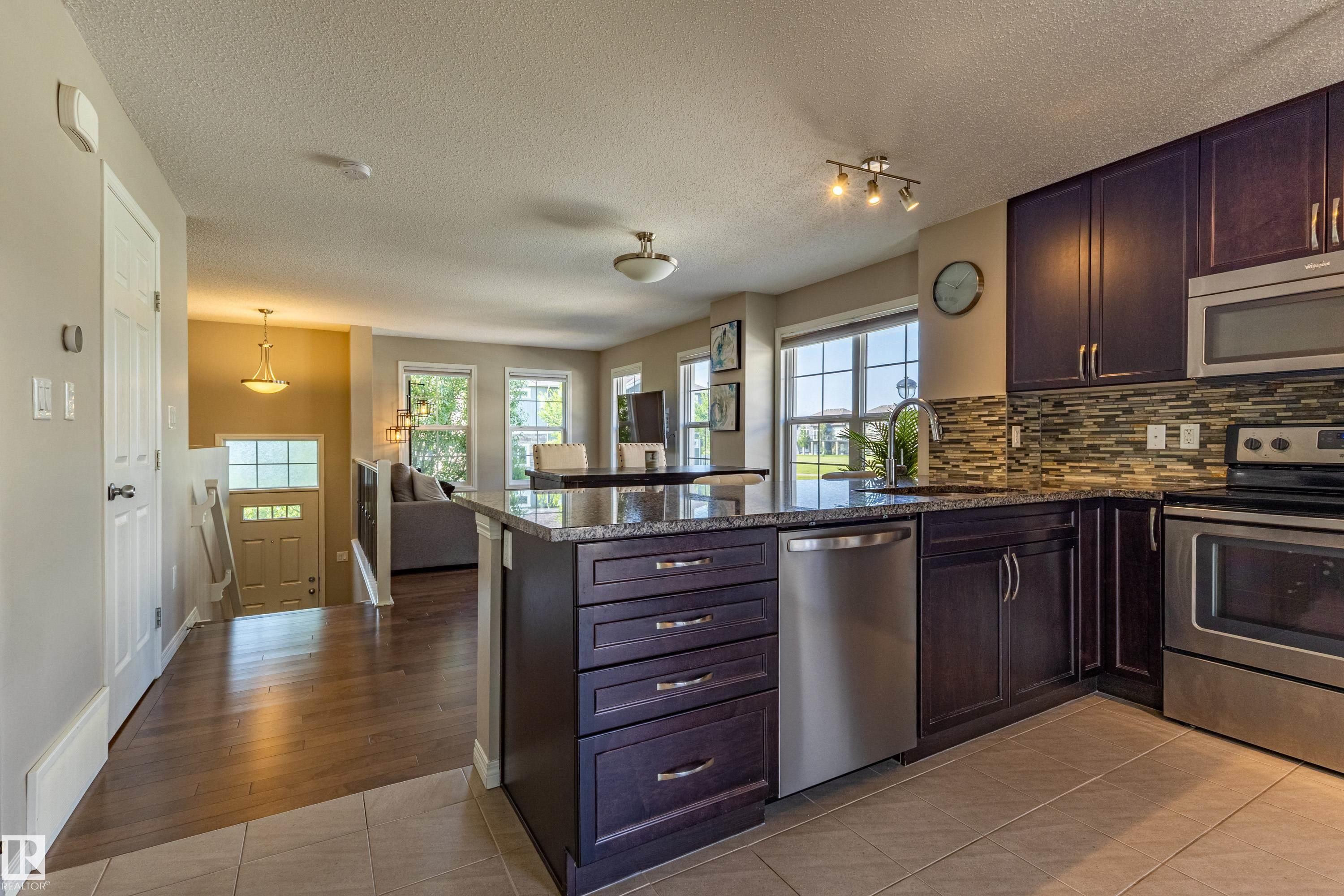 #54 4029 Orchards Dr Sw, Edmonton, AB - Indoor Photo Showing Kitchen With Stainless Steel Kitchen