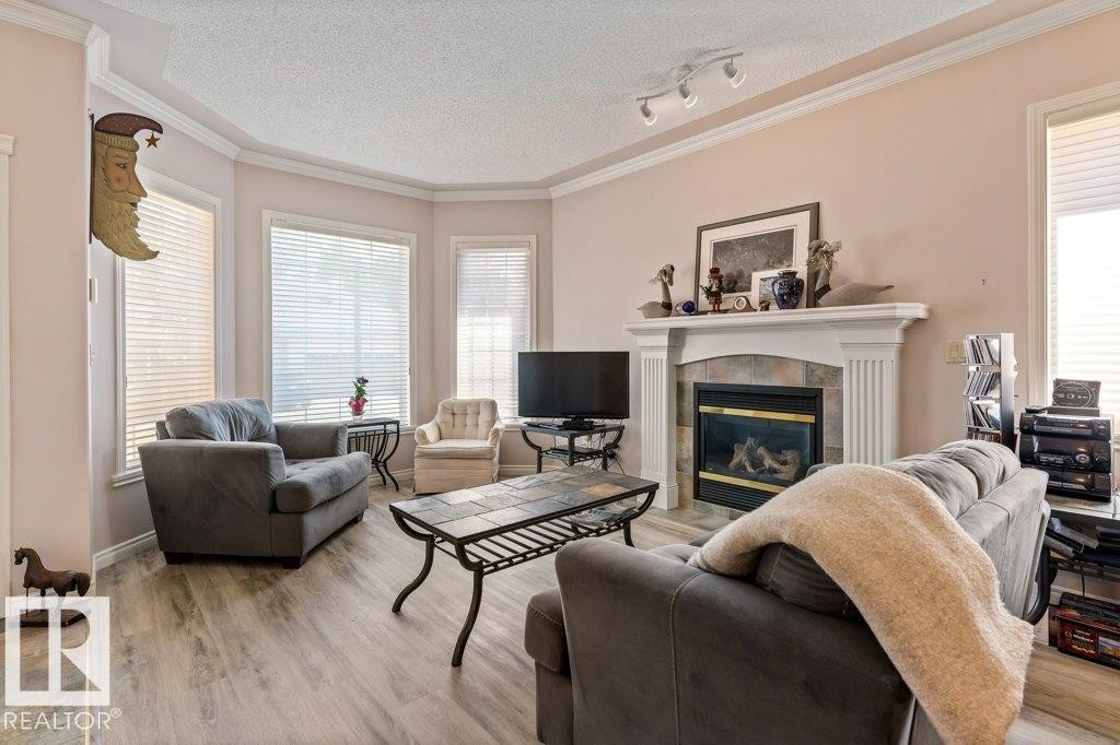 #27 170 Kingswood Bv, St. Albert, AB - Indoor Photo Showing Living Room With Fireplace