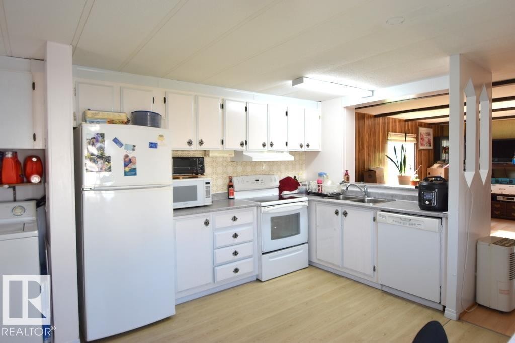 5222 3Rd Avenue, Boyle, AB - Indoor Photo Showing Kitchen With Double Sink
