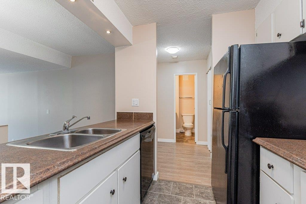 #327 10160 114 St Nw, Edmonton, AB - Indoor Photo Showing Kitchen With Double Sink