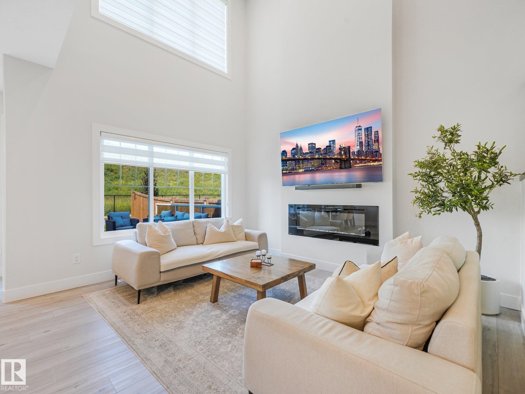 1214 Eaton Lane Nw, Edmonton, AB - Indoor Photo Showing Living Room With Fireplace