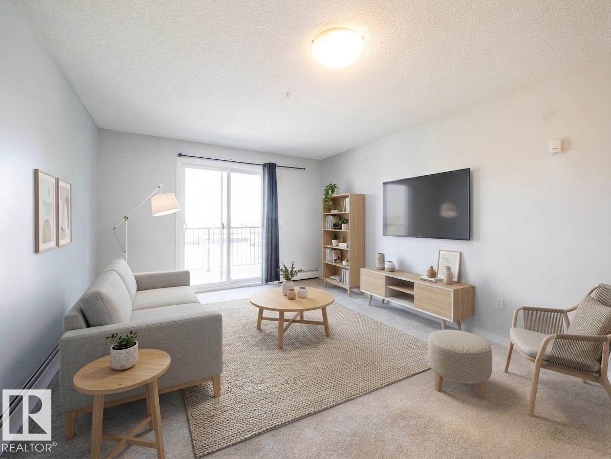 #216 392 Silverberry Road Nw, Edmonton, AB - Indoor Photo Showing Living Room