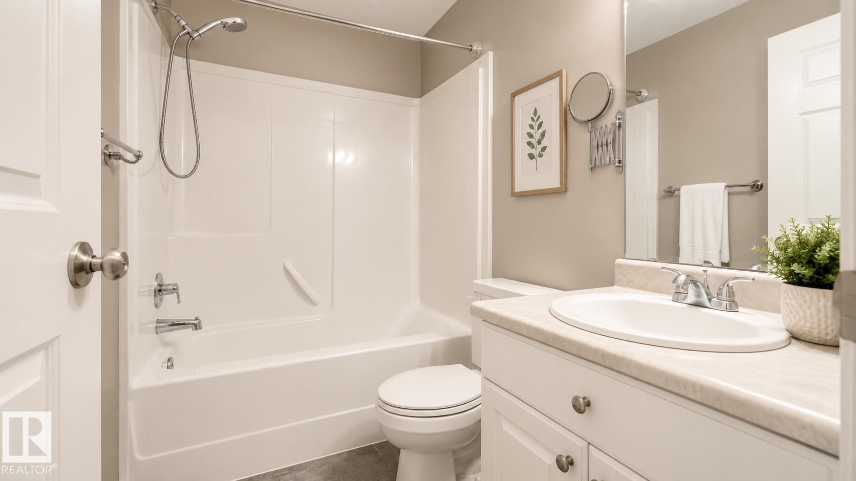 Full bathroom featuring a single vanity with an integrated sink, white cabinetry, and a full mirror - 29 Campbell Road, Leduc, AB - Indoor Photo Showing Bathroom