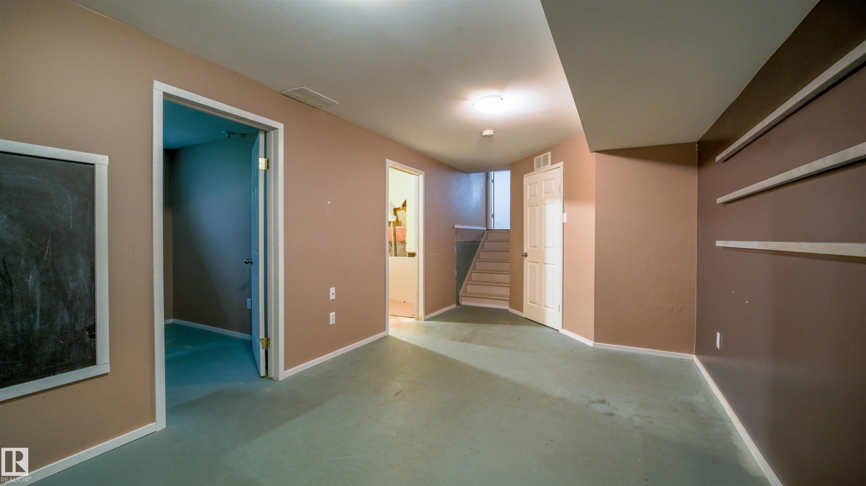 Spacious room with light neutral wall tones and light-colored flooring - 29 Campbell Road, Leduc, AB - Indoor Photo Showing Other Room