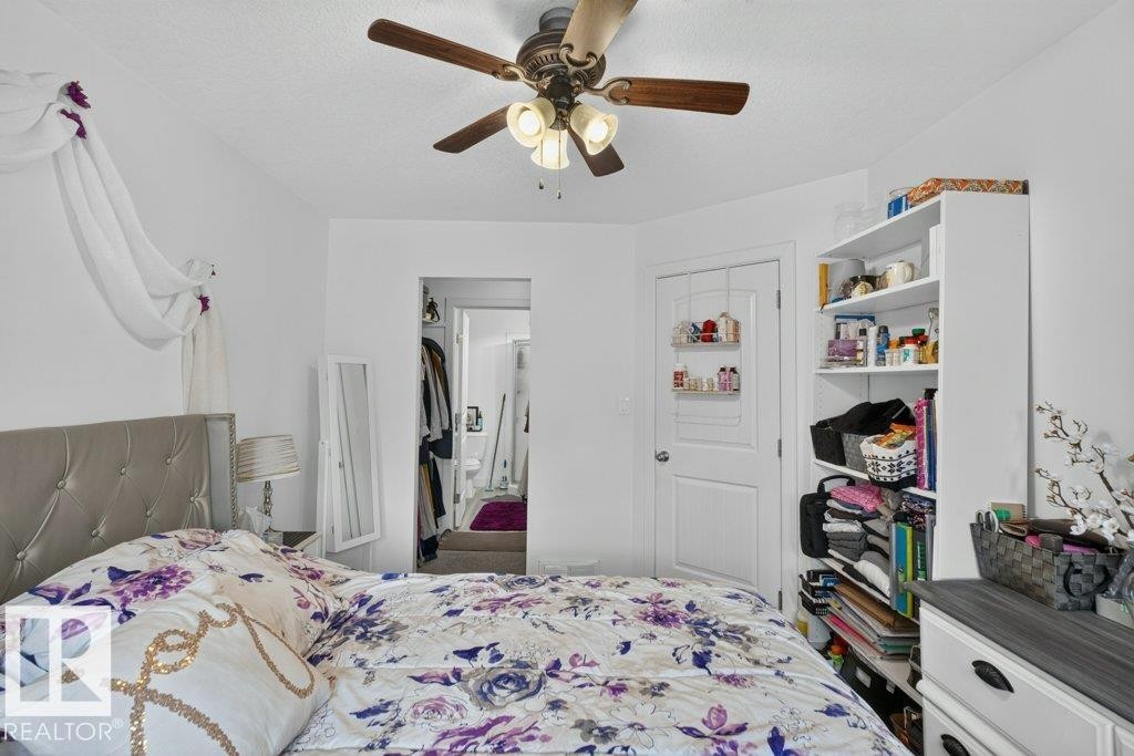 Ceiling fan with integrated lighting - 12219 89 Street Nw, Edmonton, AB - Indoor Photo Showing Bedroom