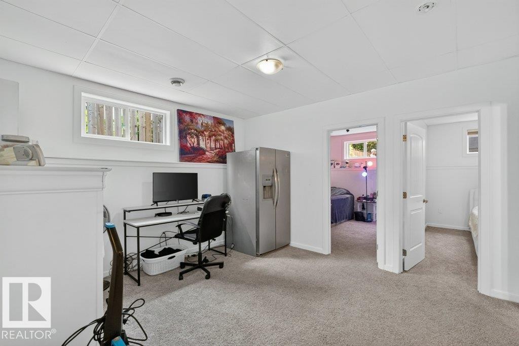 Versatile room with plush gray carpeting, white walls, and a white drop ceiling - 12219 89 Street Nw, Edmonton, AB - Indoor Photo Showing Office