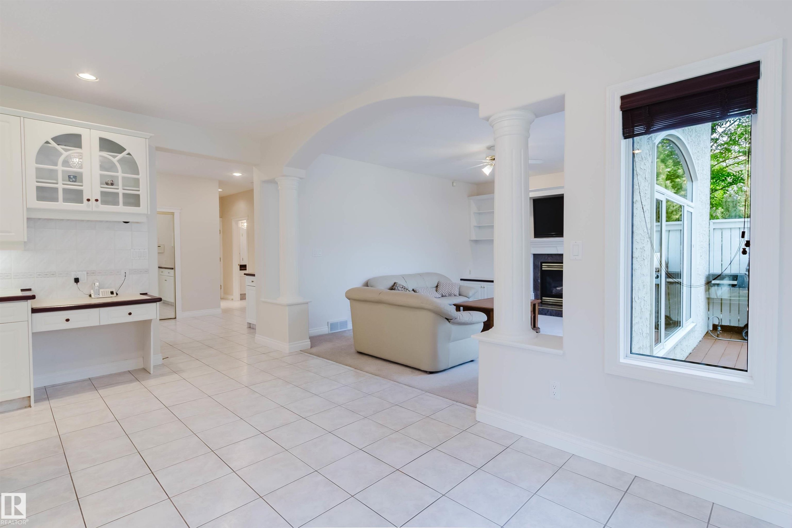 Bright interior featuring white tile flooring and white walls - 928 Heacock Road Nw, Edmonton, AB - Indoor