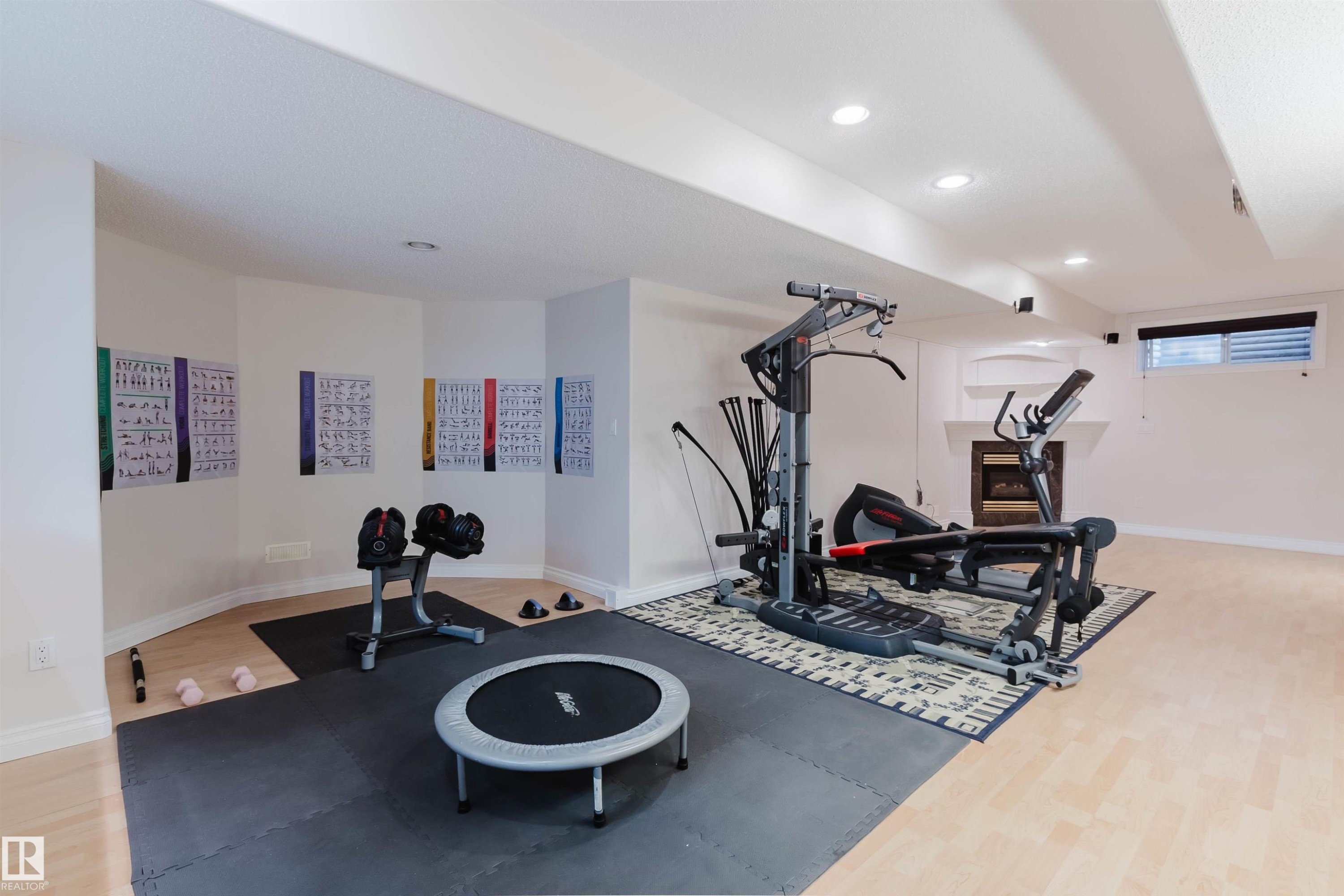 Lower level space featuring light wood-finish flooring and recessed lighting - 928 Heacock Road Nw, Edmonton, AB - Indoor Photo Showing Gym Room