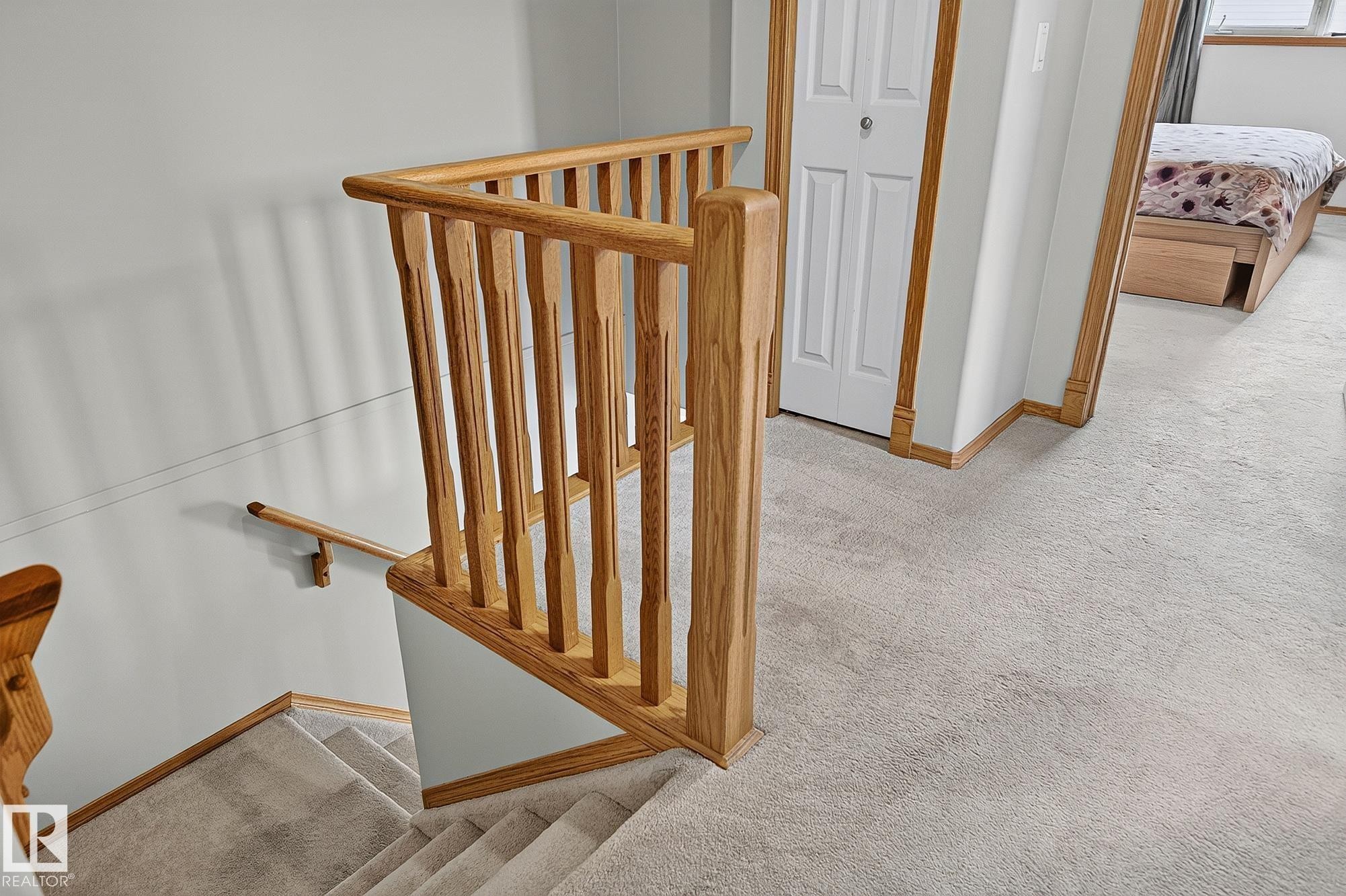 Upstairs landing with hardwood balustrade and handrail system - 385 Meadowview Terrace, Sherwood Park, AB - Indoor Photo Showing Other Room