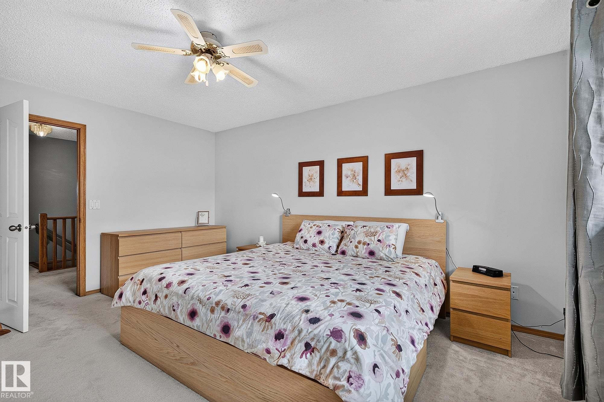 Primary bedroom suite featuring light-toned carpeting and neutral wall tones - 385 Meadowview Terrace, Sherwood Park, AB - Indoor Photo Showing Bedroom
