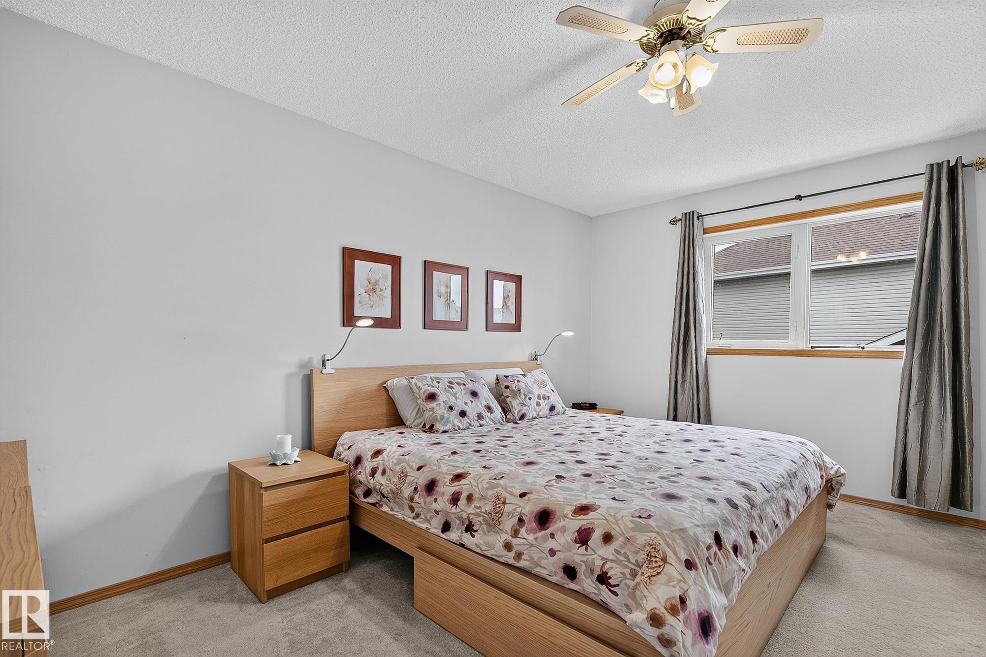 Huge light-filled main bedroom featuring light-coloured walls and neutral carpeting - 385 Meadowview Terrace, Sherwood Park, AB - Indoor Photo Showing Bedroom