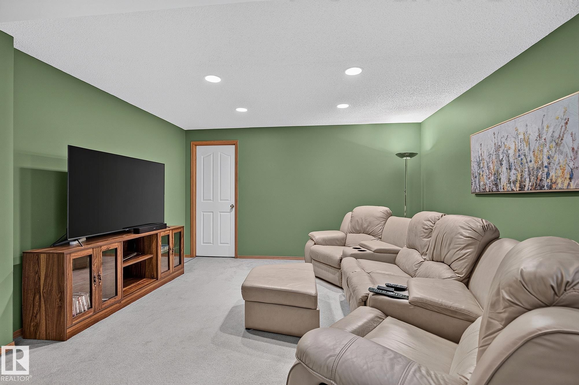 Carpeted room with recessed lighting and a wood-finish media console - 385 Meadowview Terrace, Sherwood Park, AB - Indoor