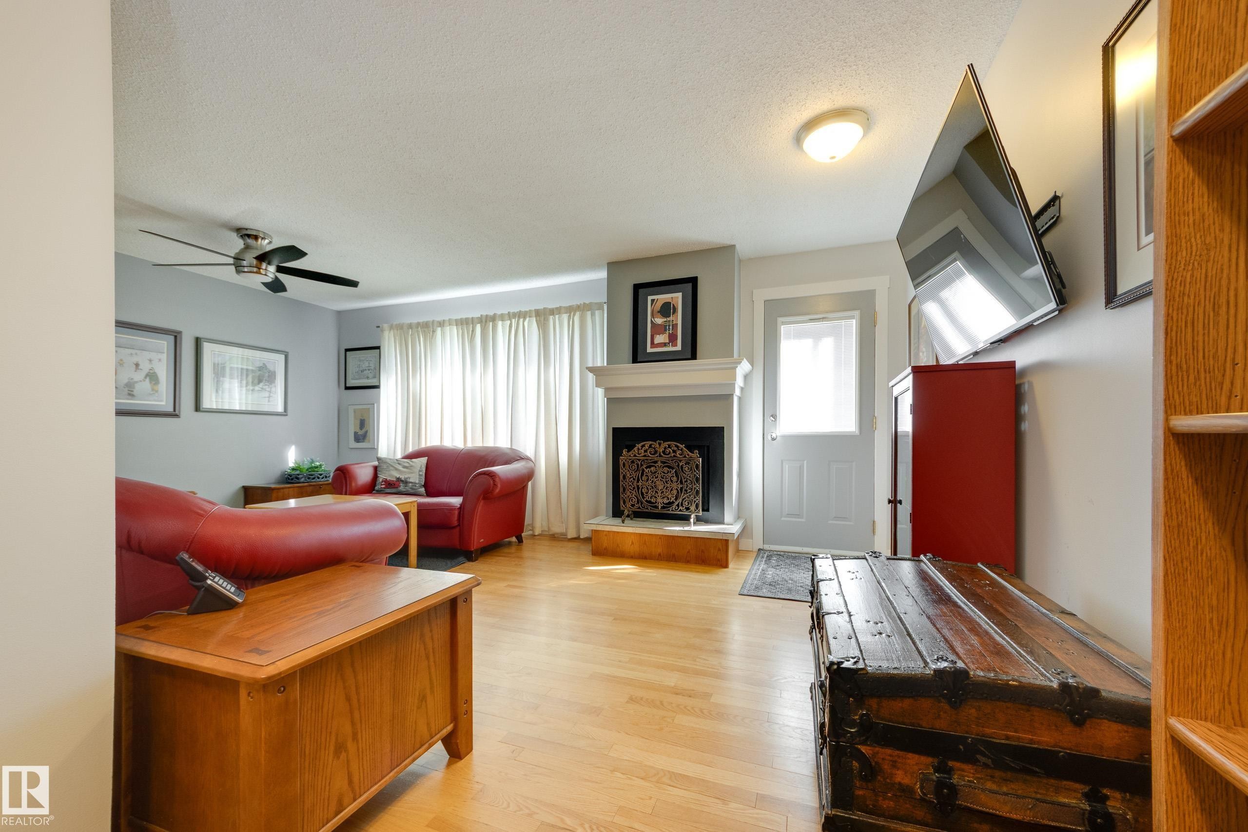 4303 46 Street, Stony Plain, AB - Indoor Photo Showing Living Room With Fireplace