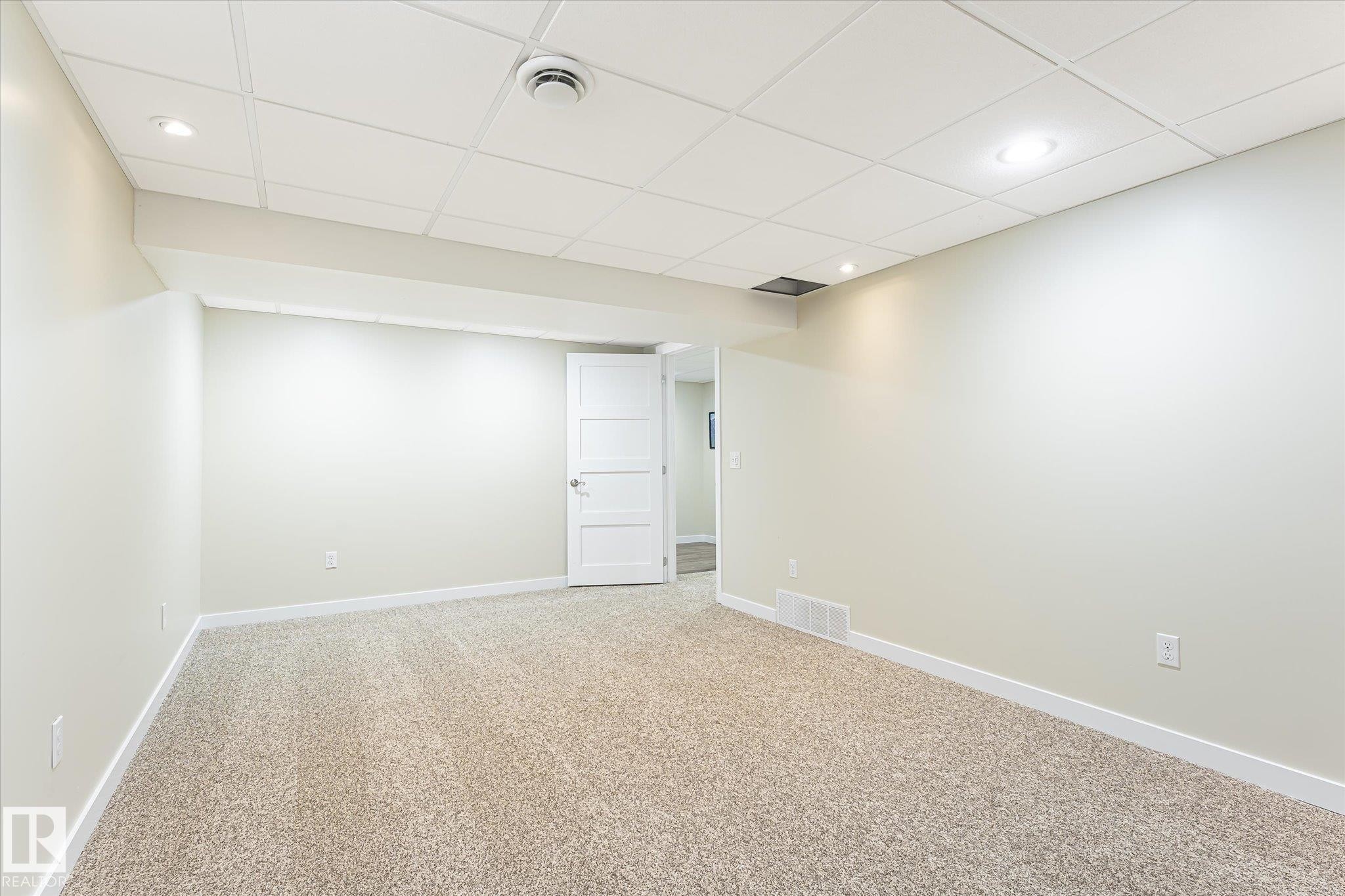 Room featuring light-toned carpeting, white walls, and a white drop ceiling with recessed lighting - 4921 47 Avenue, Legal, AB - Indoor Photo Showing Other Room