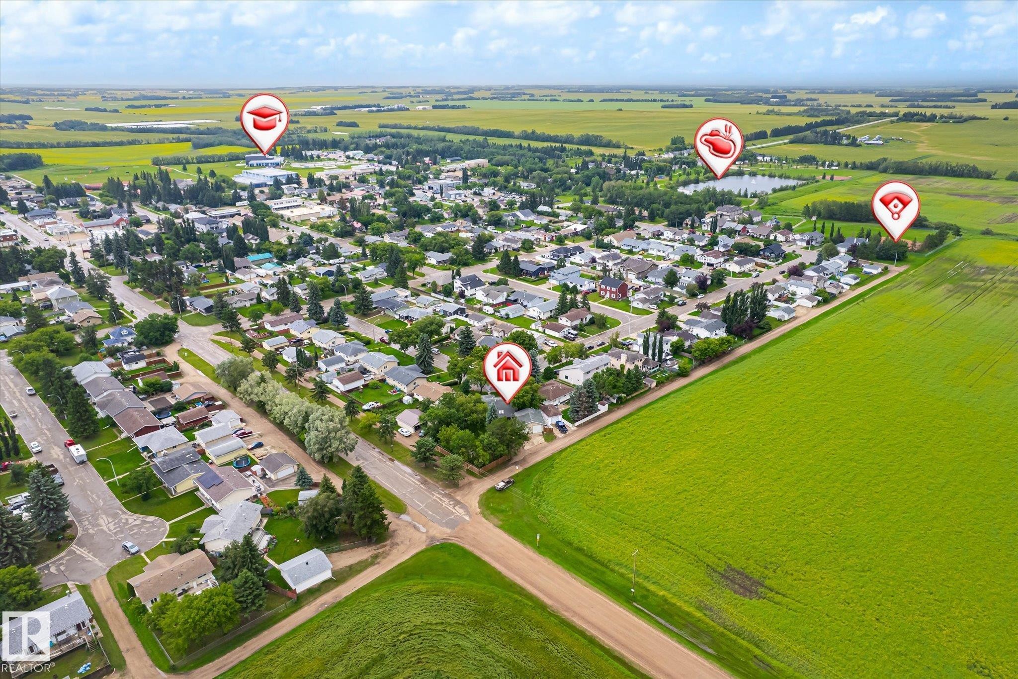 Aerial depiction of a residential neighborhood with surrounding green fields - 4921 47 Avenue, Legal, AB - Outdoor With View