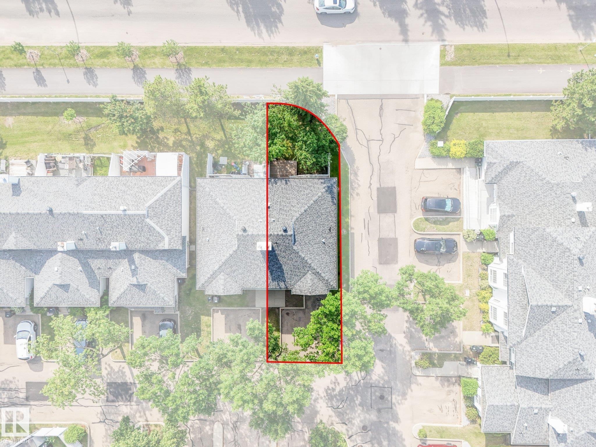 Aerial property overview featuring a shingled roofline, established trees, and a defined property boundary - #2 3311 58 St Nw, Edmonton, AB -