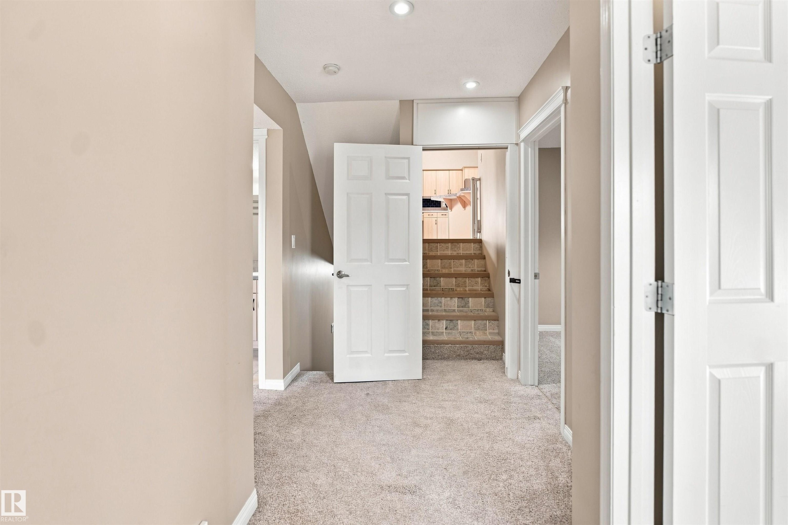 Hallway featuring light beige carpeting and recessed lighting - 1328 80 Street Sw, Edmonton, AB - Indoor Photo Showing Other Room