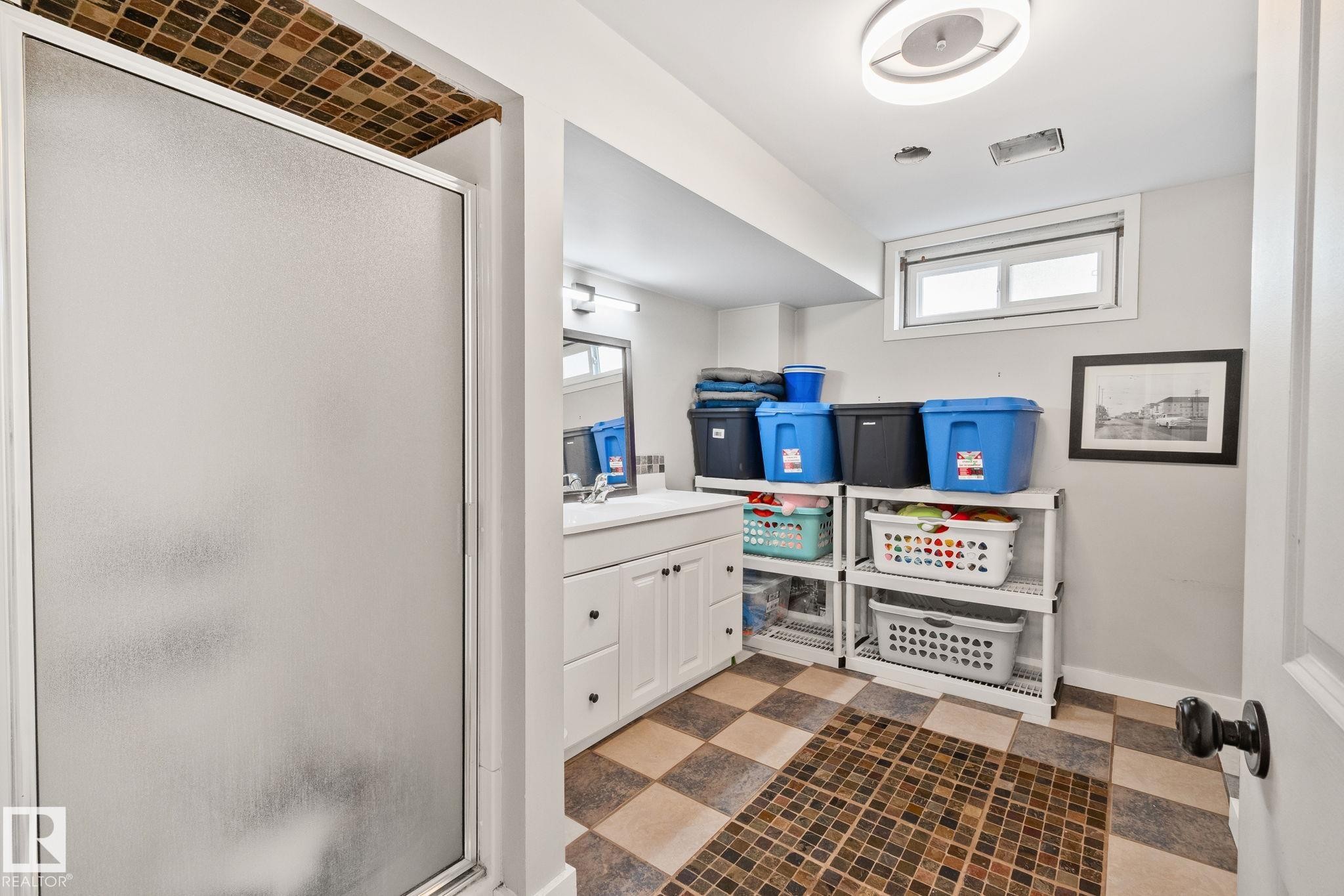 Frosted glass shower enclosure featuring mosaic tile surround - 4723 105 Street Nw, Edmonton, AB - Indoor