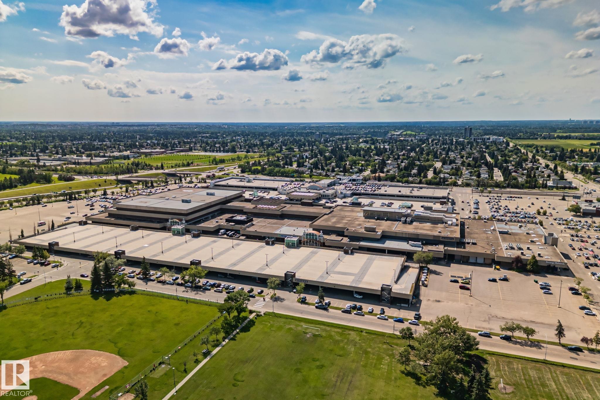 Sprawling commercial complex with extensive surface parking and surrounding green spaces - 4723 105 Street Nw, Edmonton, AB - Outdoor With View