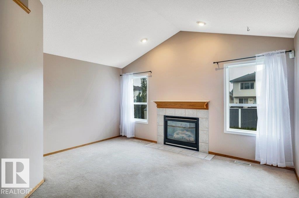 4051 33 Street Nw, Edmonton, AB - Indoor Photo Showing Living Room With Fireplace
