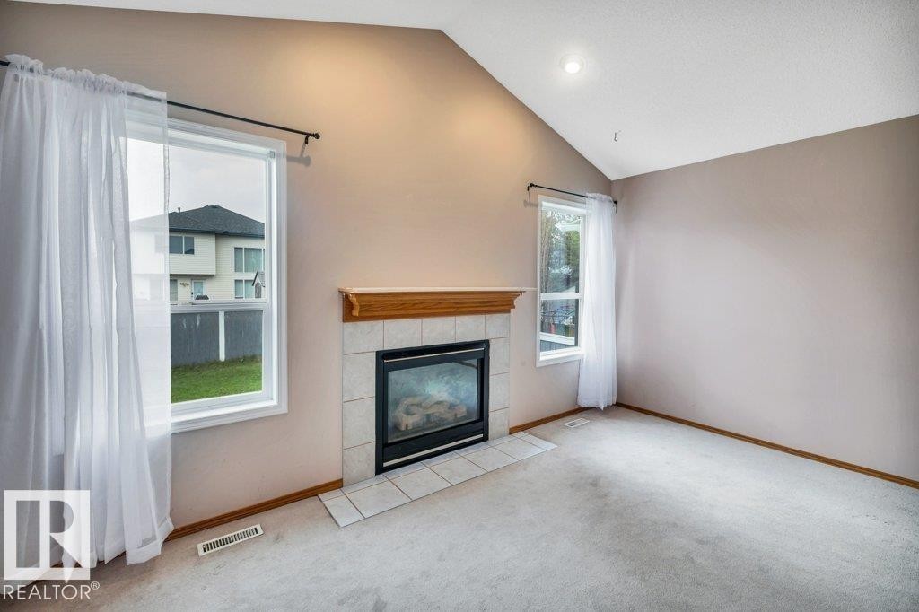 4051 33 Street Nw, Edmonton, AB - Indoor Photo Showing Living Room With Fireplace