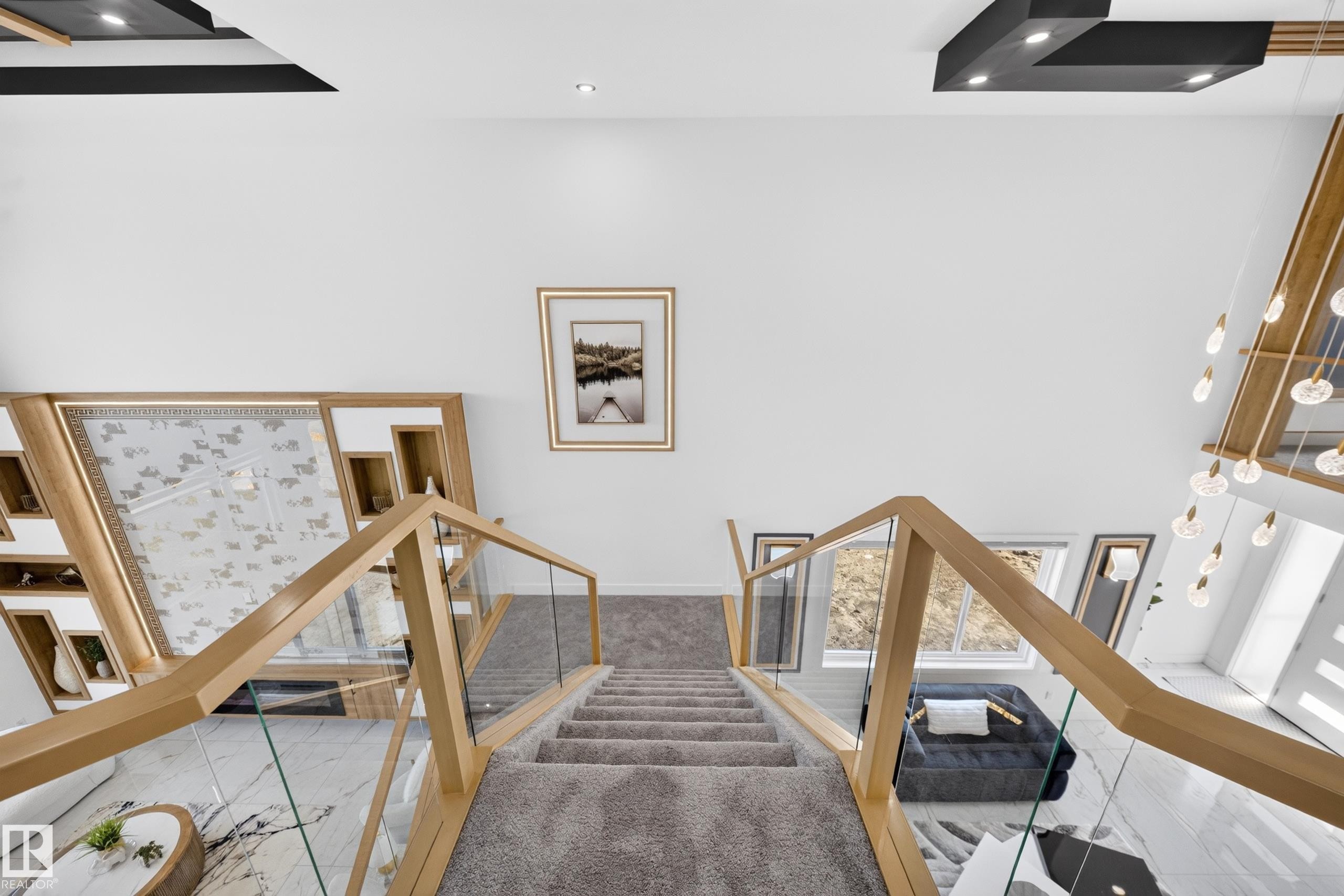 Carpeted staircase with light wood-finish and glass railings - 423 Robinson Bv, Leduc, AB - Indoor Photo Showing Other Room