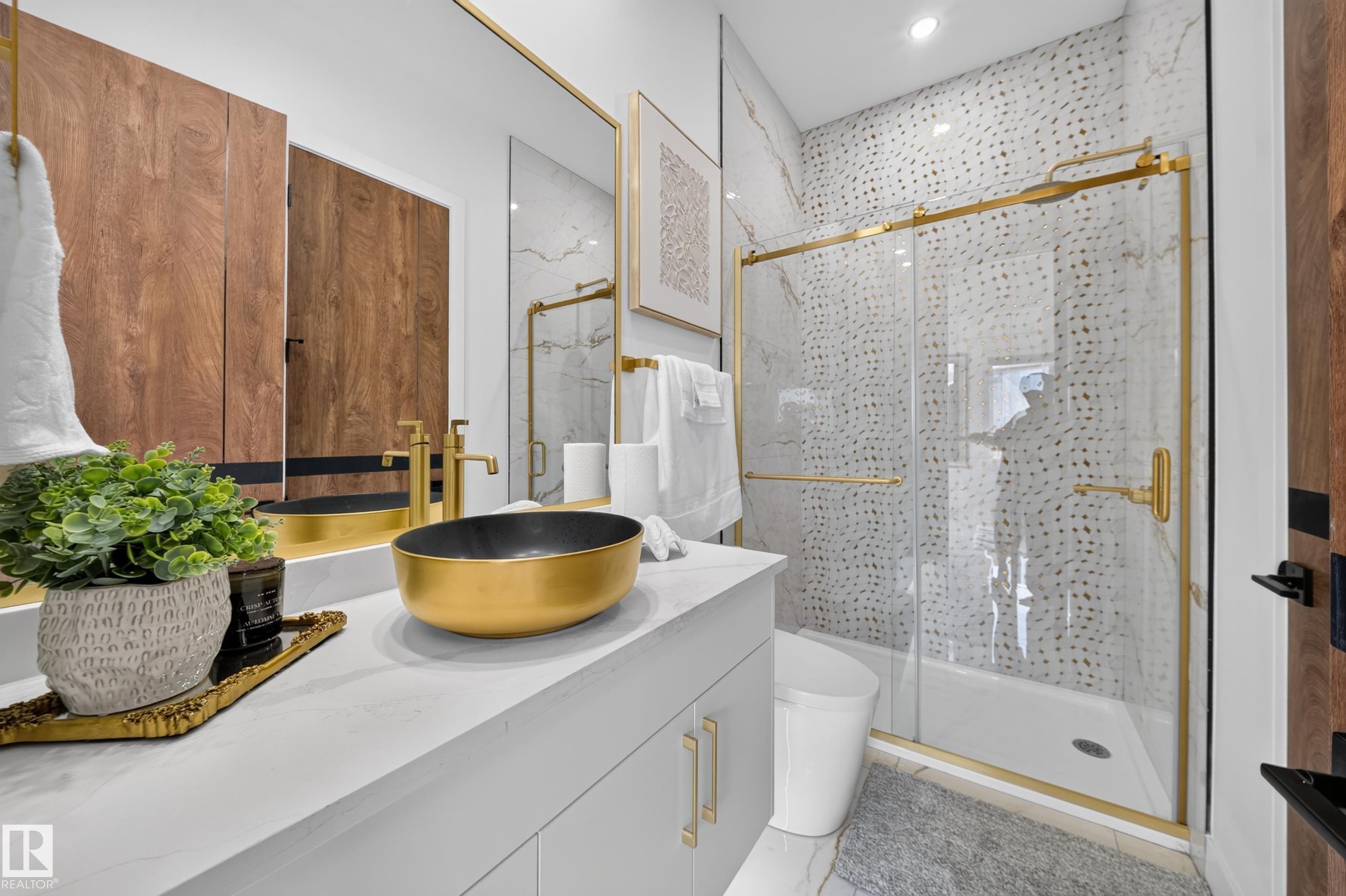 Bathroom featuring a gold vessel sink, white countertop, and light gray cabinetry with gold hardware - 423 Robinson Bv, Leduc, AB - Indoor Photo Showing Other Room