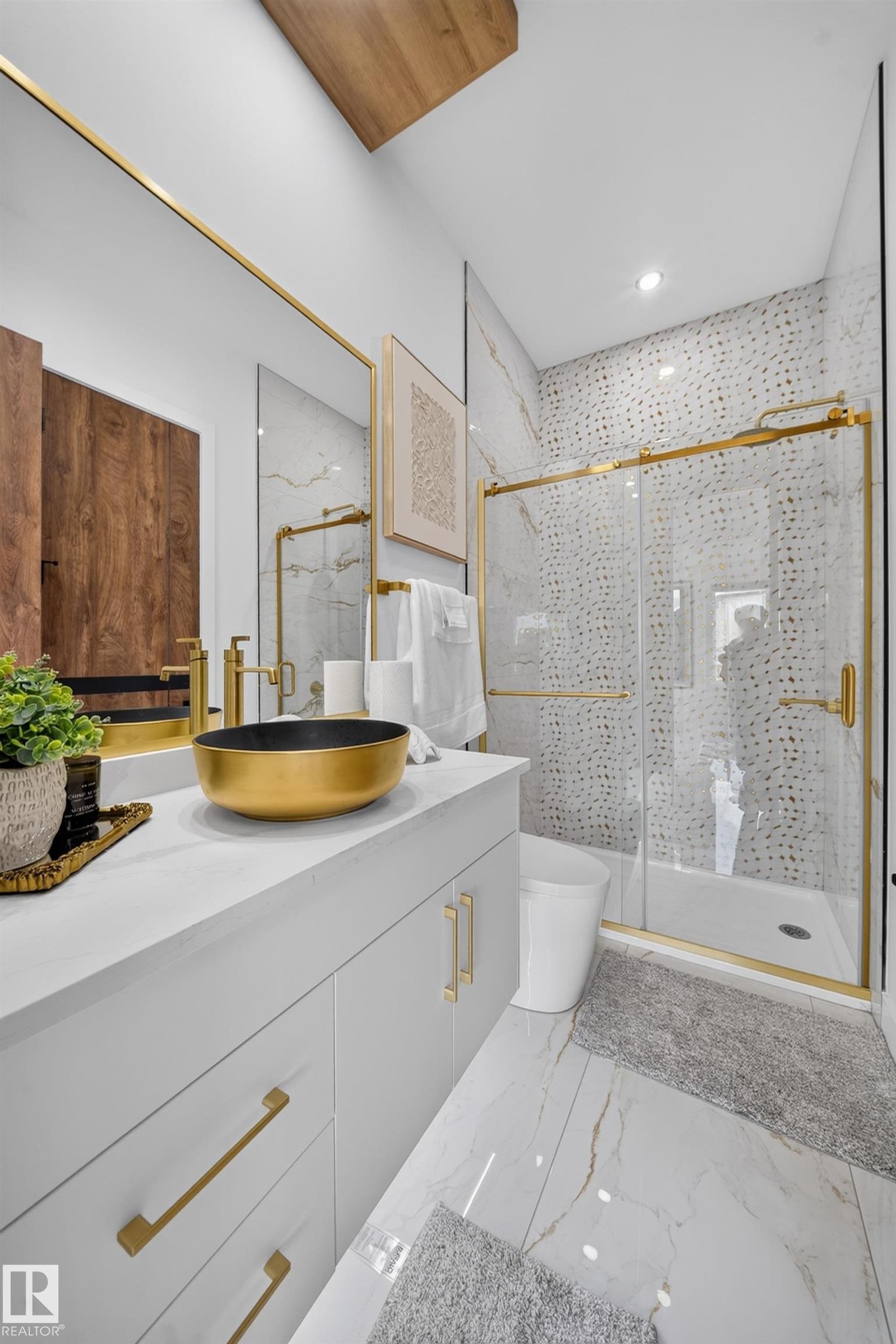 Bathroom featuring a gold vessel sink, white cabinetry with gold hardware, and a walk-in shower with a glass enclosure - 423 Robinson Bv, Leduc, AB - Indoor Photo Showing Bathroom