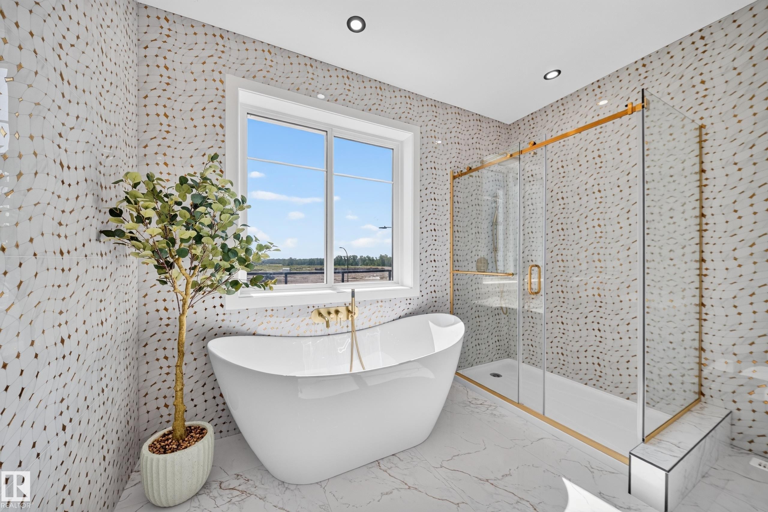 Freestanding soaking tub with gold-tone fixtures - 423 Robinson Bv, Leduc, AB - Indoor Photo Showing Bathroom