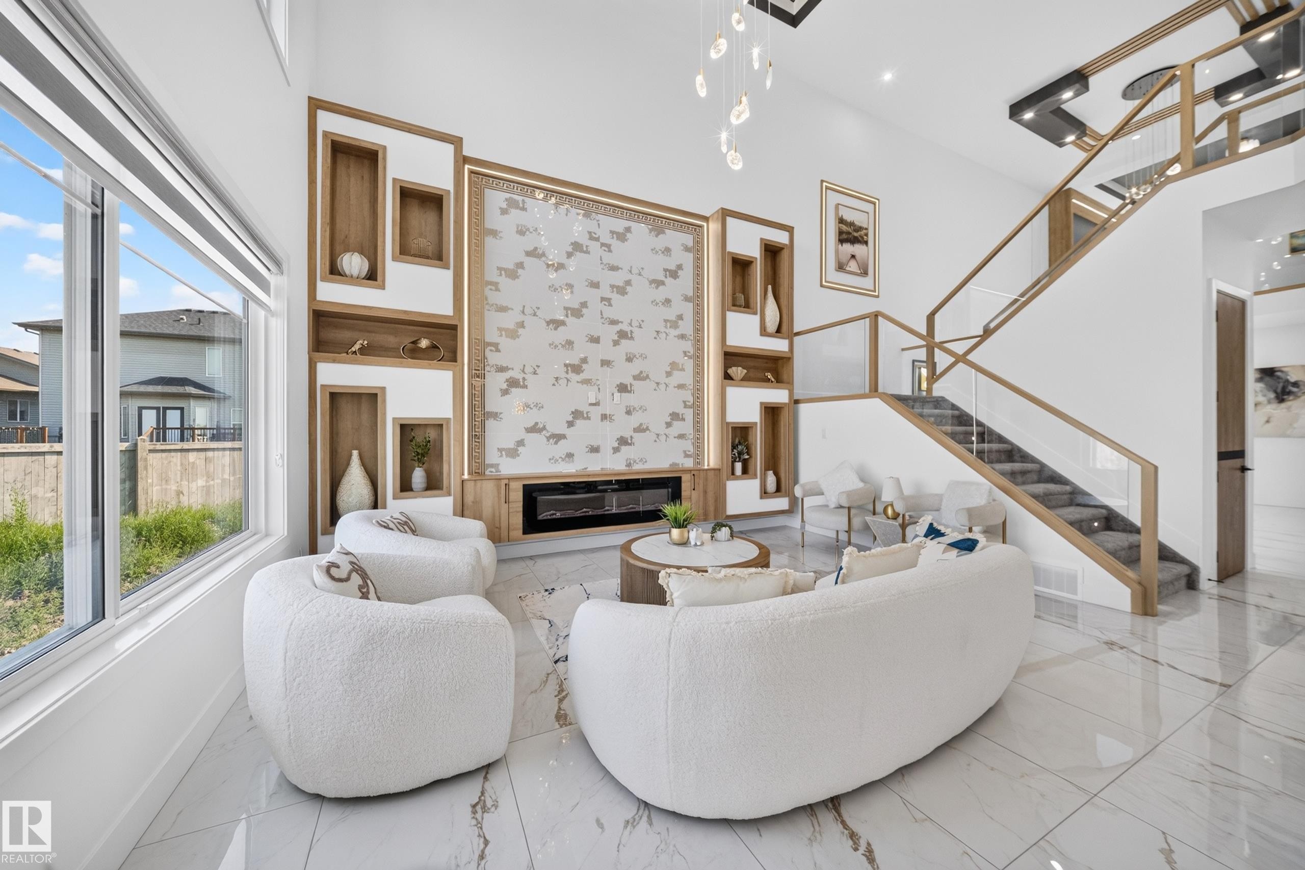 Bright interior space featuring a double-height ceiling, large windows, and polished tile flooring - 423 Robinson Bv, Leduc, AB - Indoor With Fireplace
