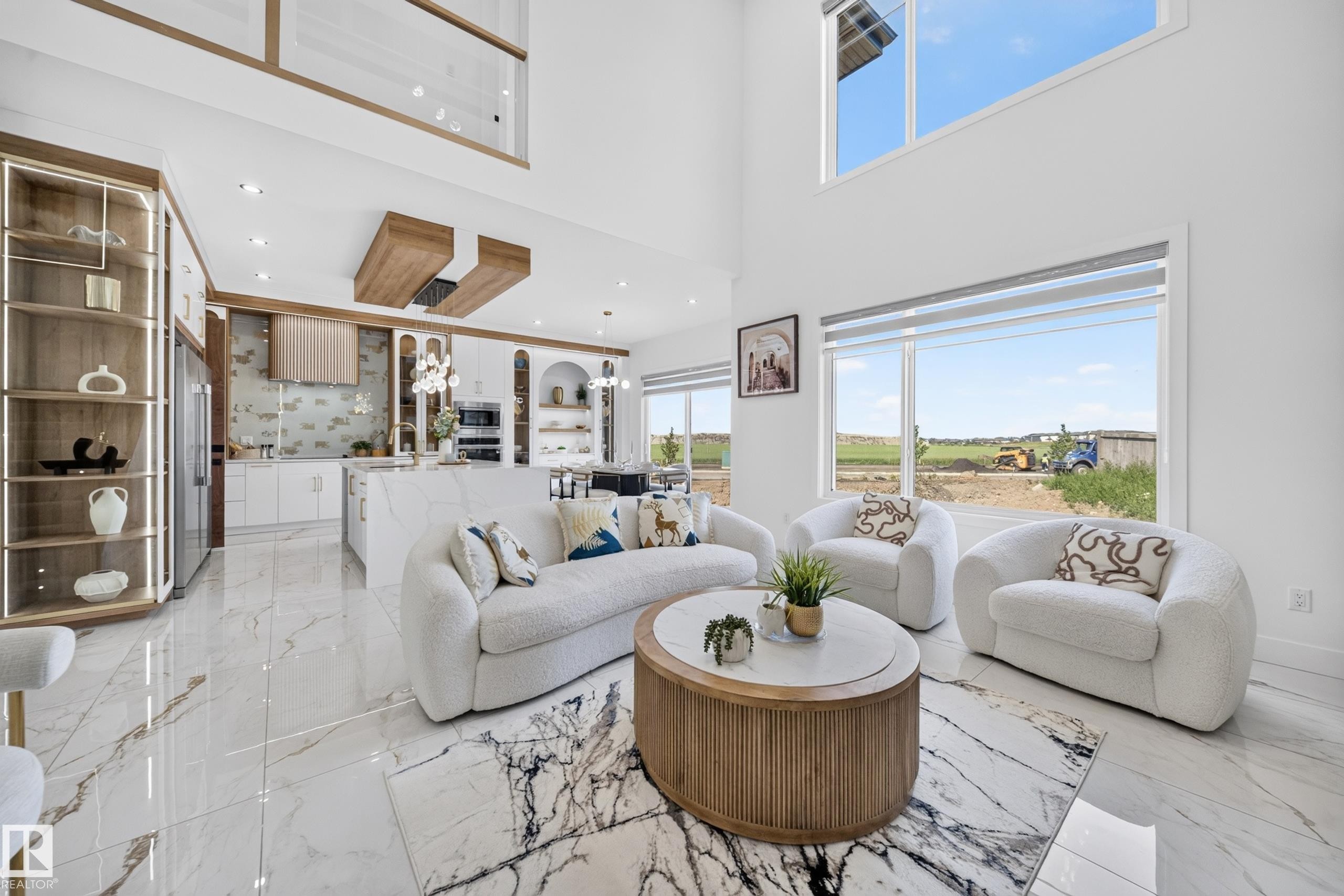 Spacious living area featuring high ceilings, large windows, and polished tile flooring - 423 Robinson Bv, Leduc, AB - Indoor Photo Showing Living Room