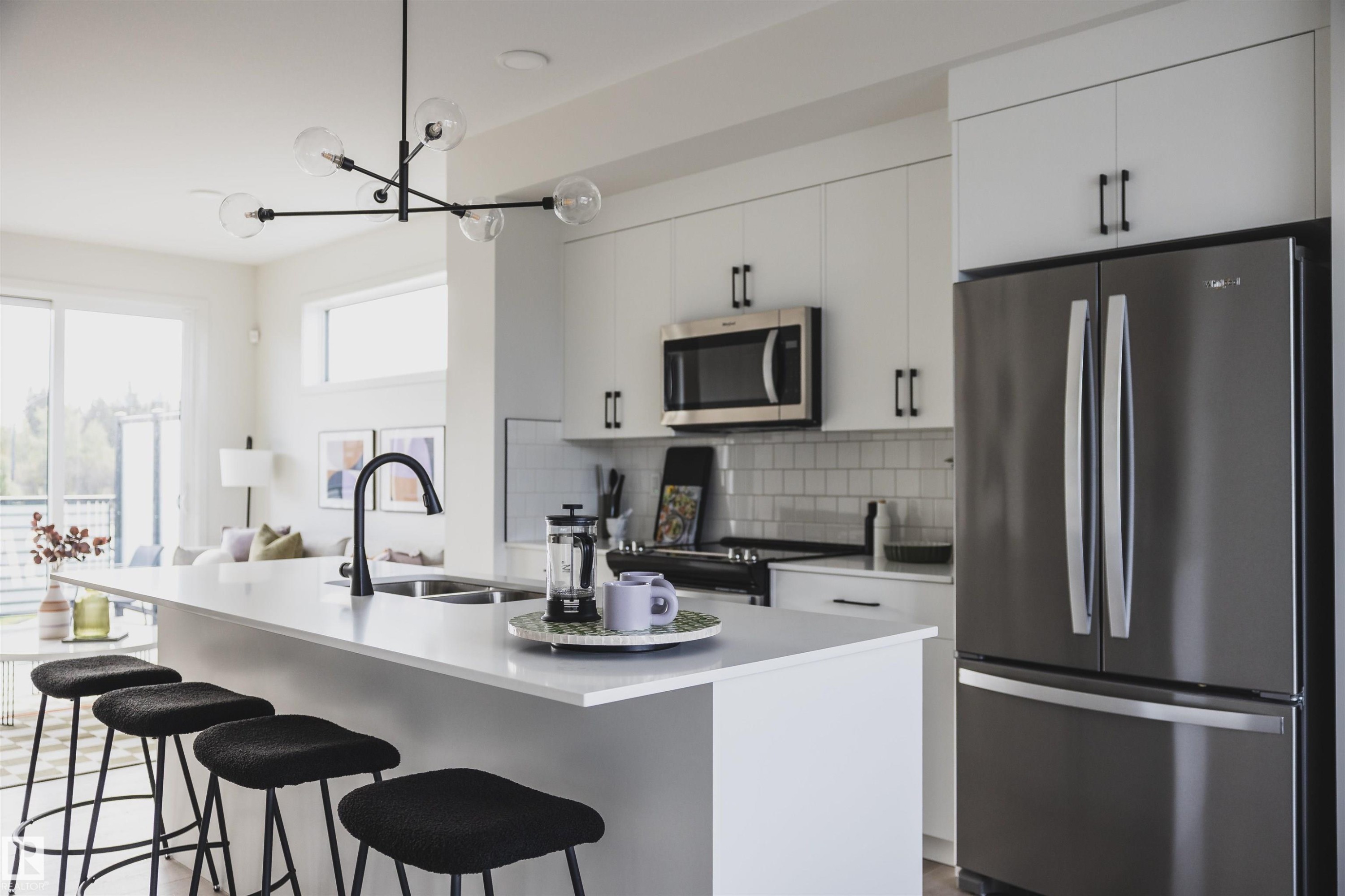 7 Roseburn Trail, Fort Saskatchewan, AB - Indoor Photo Showing Kitchen With Stainless Steel Kitchen With Double Sink With Upgraded Kitchen