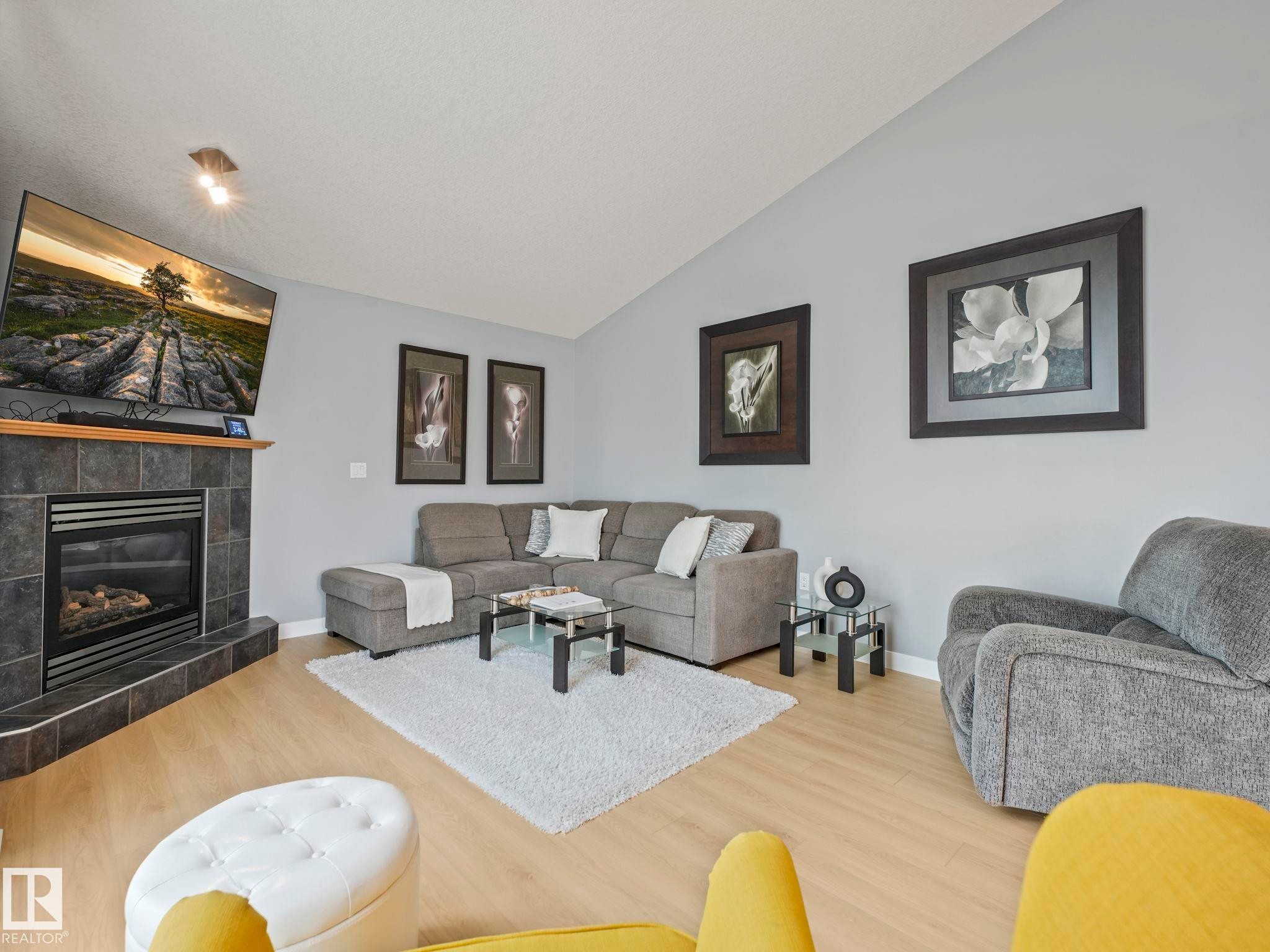 4115 58 Street, Beaumont, AB - Indoor Photo Showing Living Room With Fireplace